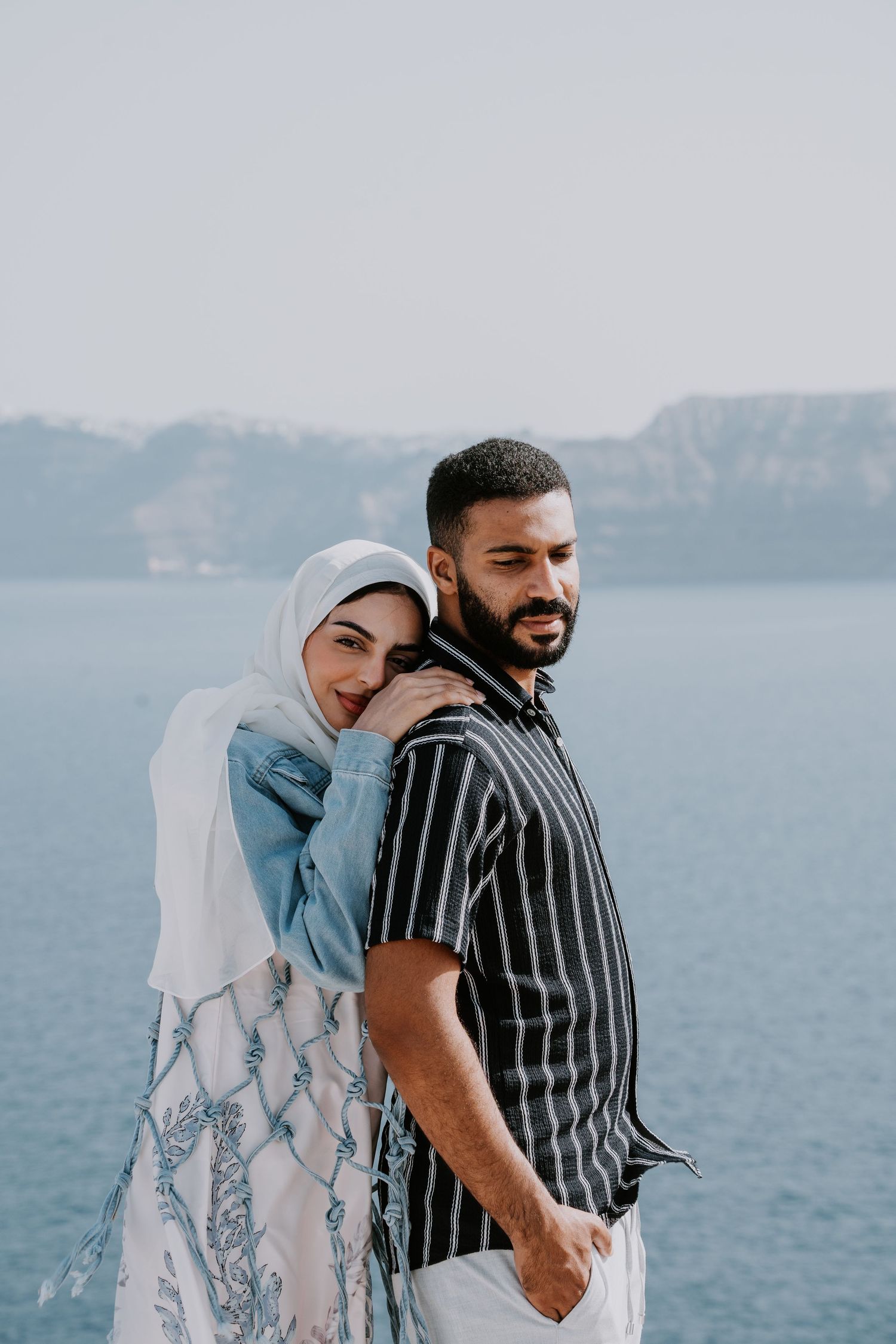 santorini photographer couple session oia sunset blue domes romantic photoshoot greece