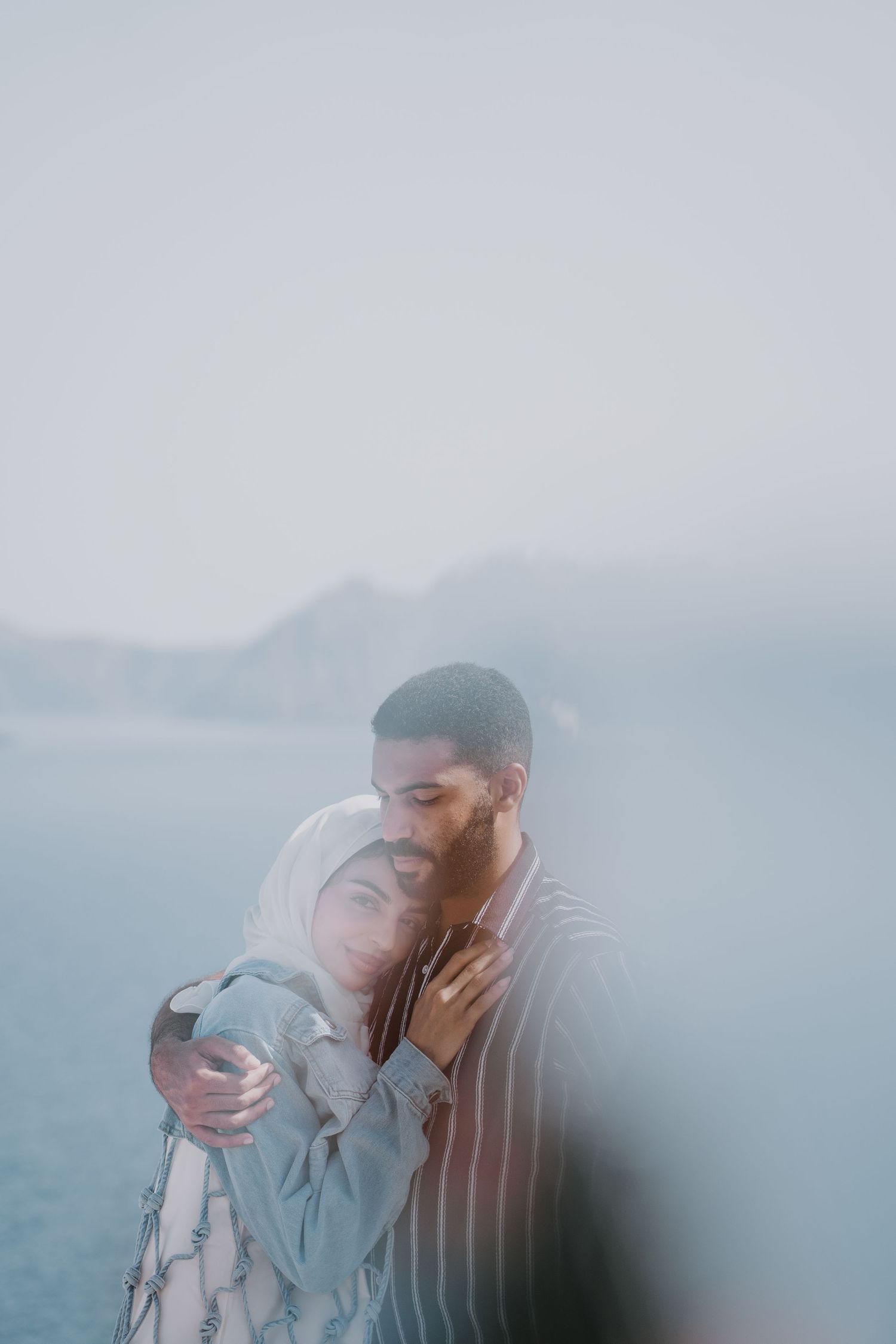 santorini photographer couple session oia sunset blue domes romantic photoshoot greece