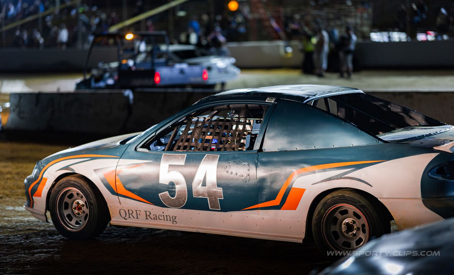 QRF Racing dirt track car at Potomac Speedway. High-speed motorsports action photography R&D by Fairfax-based Sporty-Clips Media.