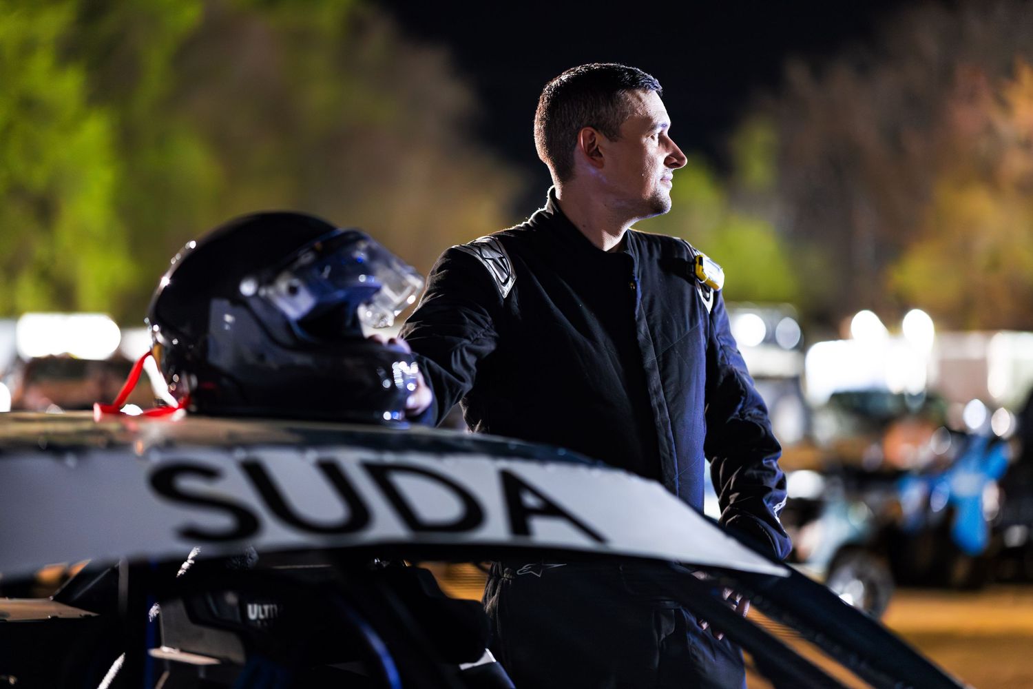 Elite image of a race car driver taken using flagship Canon camera and lenses.