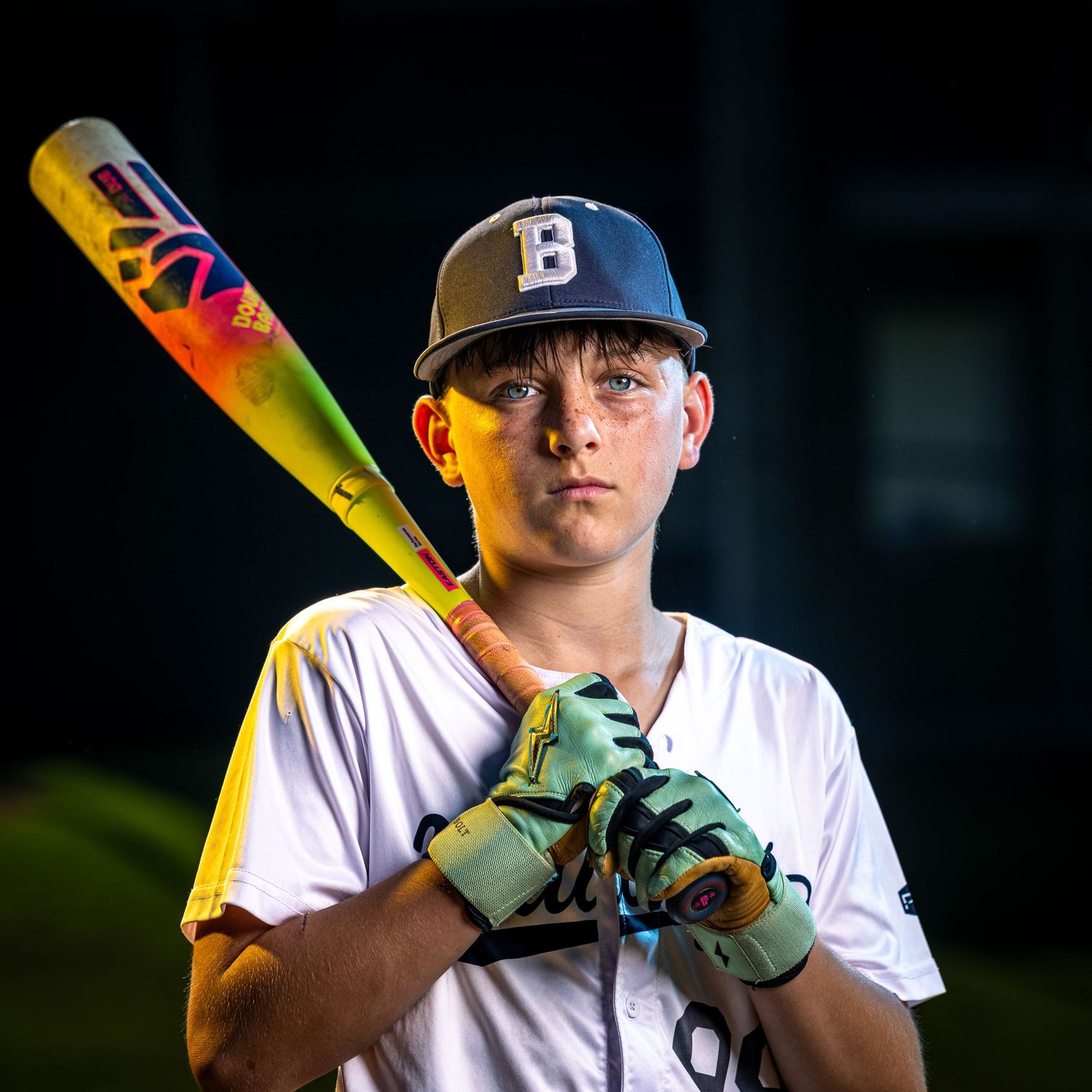 Burke Bulldogs travel baseball player strobe sportrait. Premium youth sports photography in Fairfax County by Sporty-Clips Media.