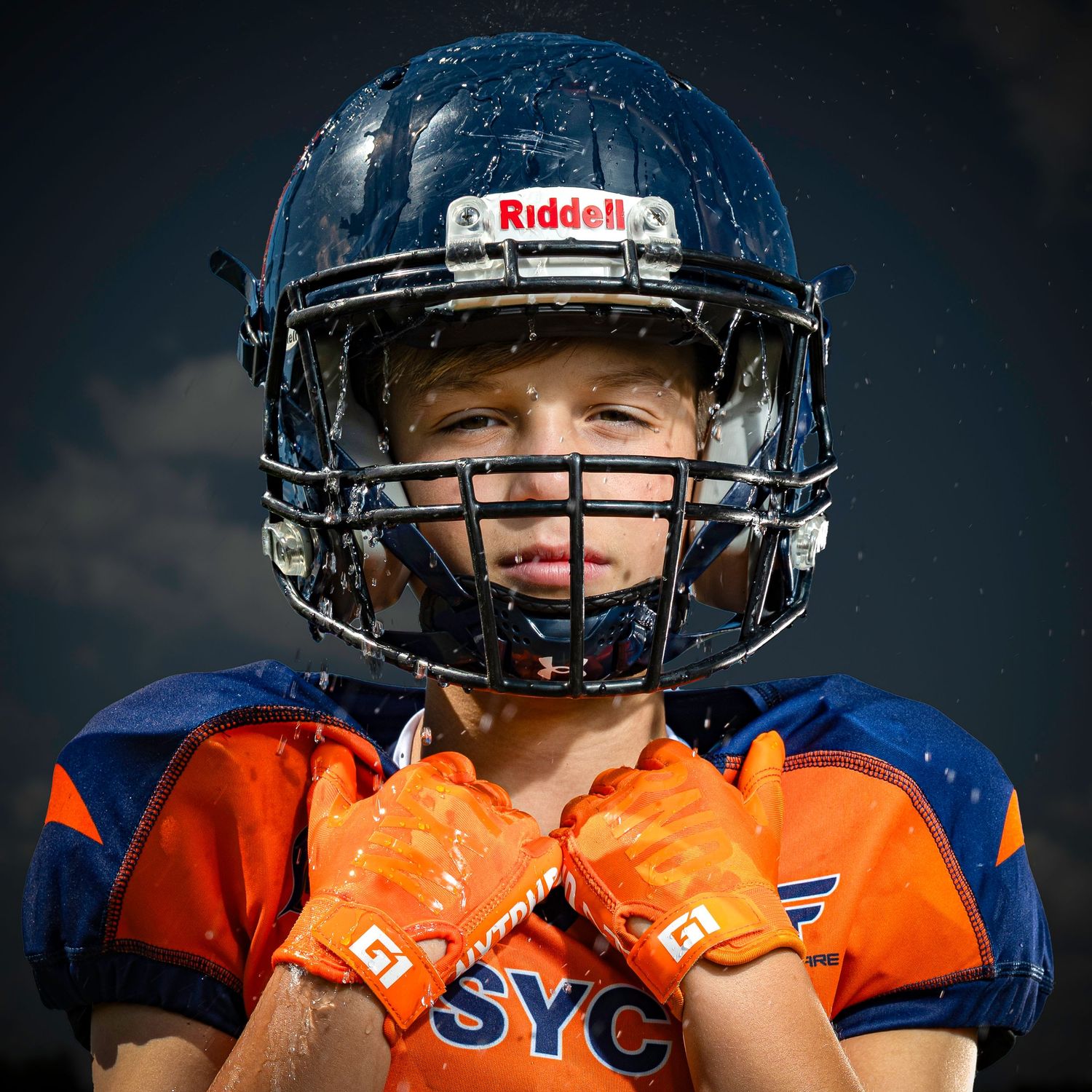 Football media day photo session using elite Canon camera and lenses and Godox strobes.