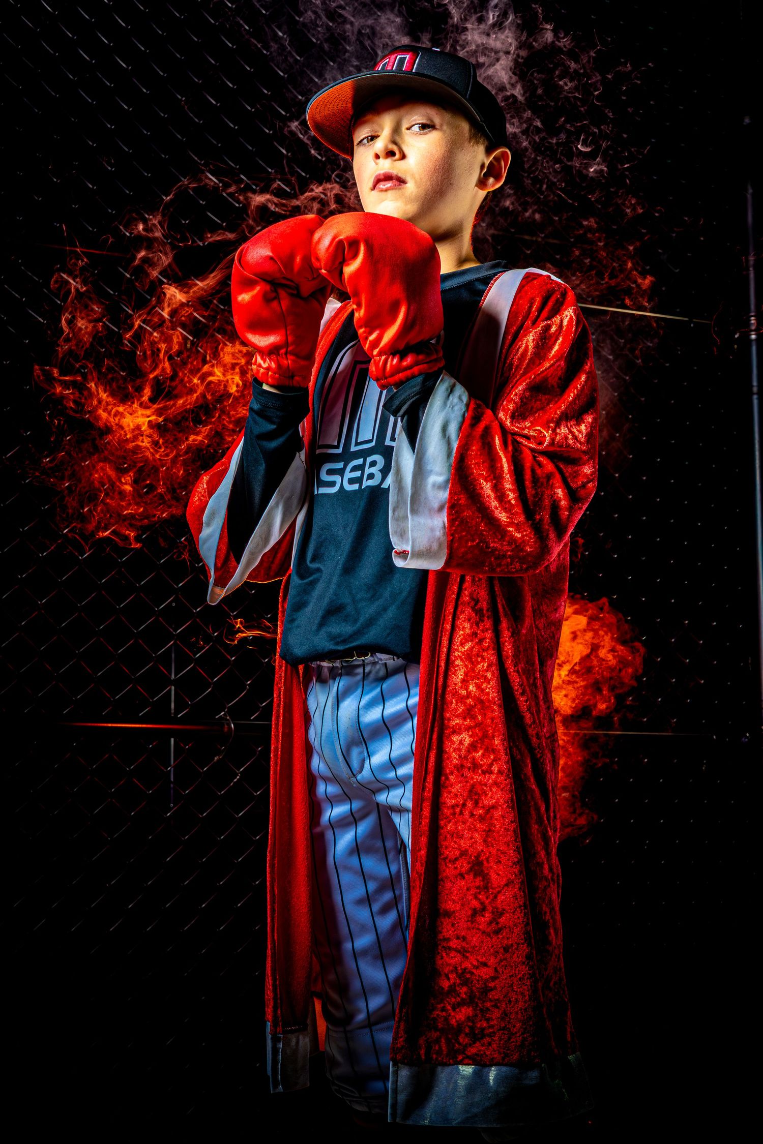 Cinematic baseball portrait in Fairfax VA. Stylized boxing theme with colored fog and strobe lighting. Captured with 8K flagship technology.