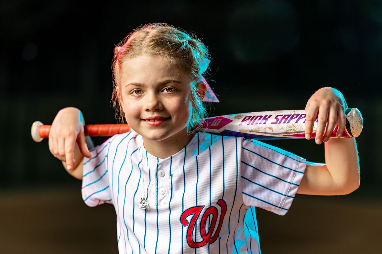Premium high-speed sync softball portrait by Sporty-Clips Media. Cotton Candy Crushers athlete in Fairfax VA. Elite youth sports photography