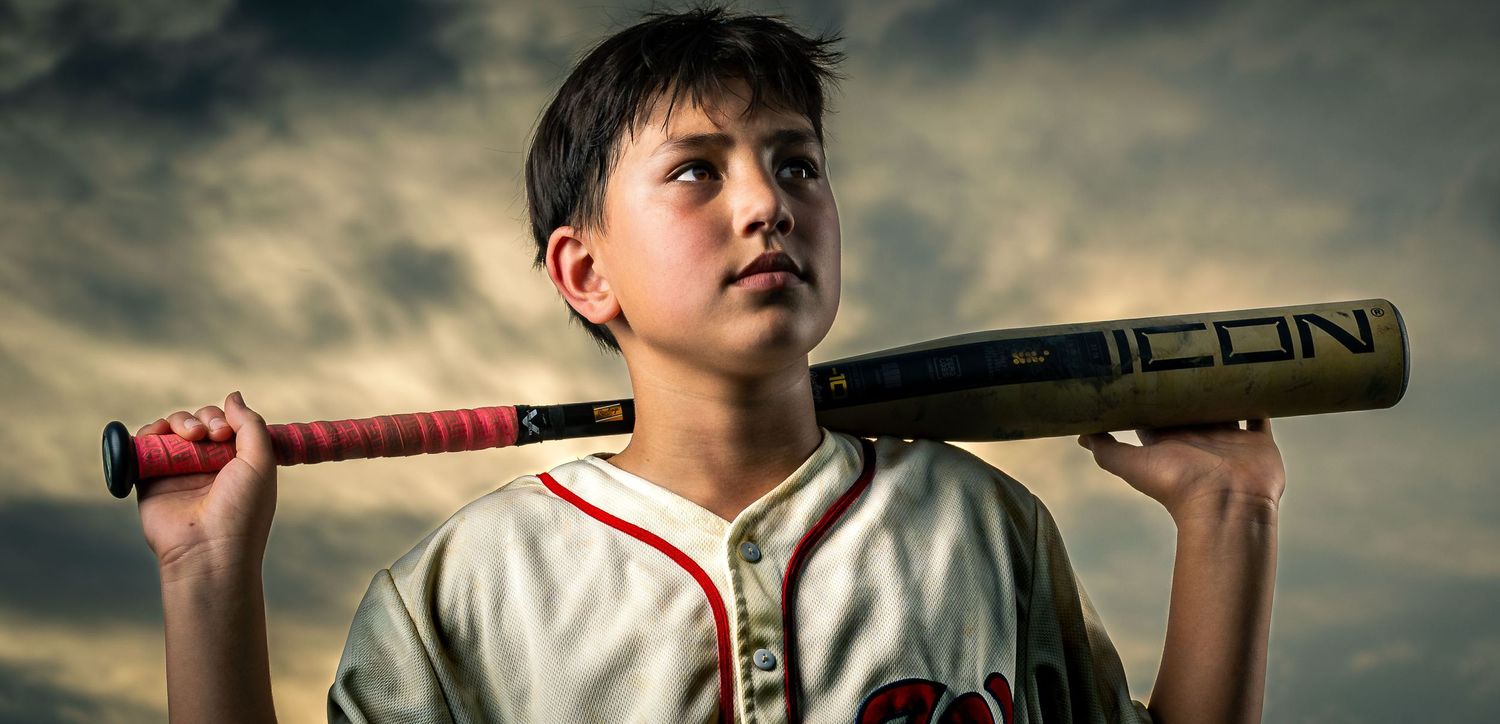 Elite youth travel baseball signature portrait under dramatic skies by Sporty-Clips Media in Northern Virginia.
