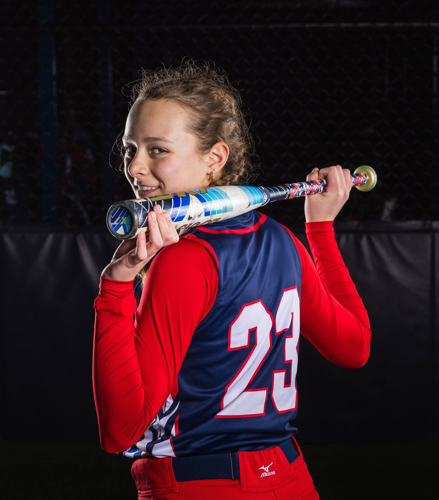 Softball media day photo session using elite Canon camera and lenses and Godox strobes.