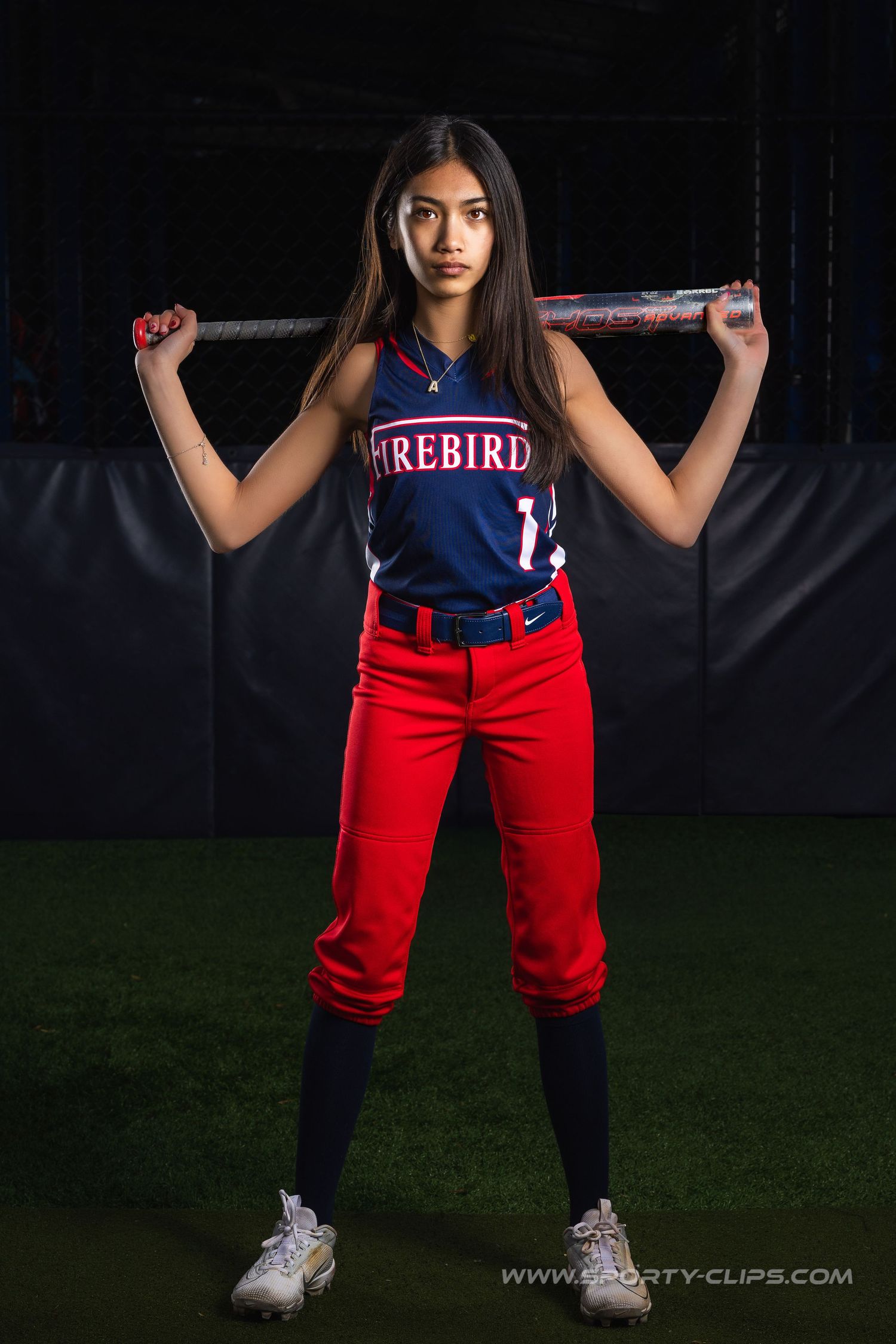 Elite Firebirds fast-pitch softball strobe sportrait. Premium Northern Virginia youth sports photography by Sporty-Clips Media.