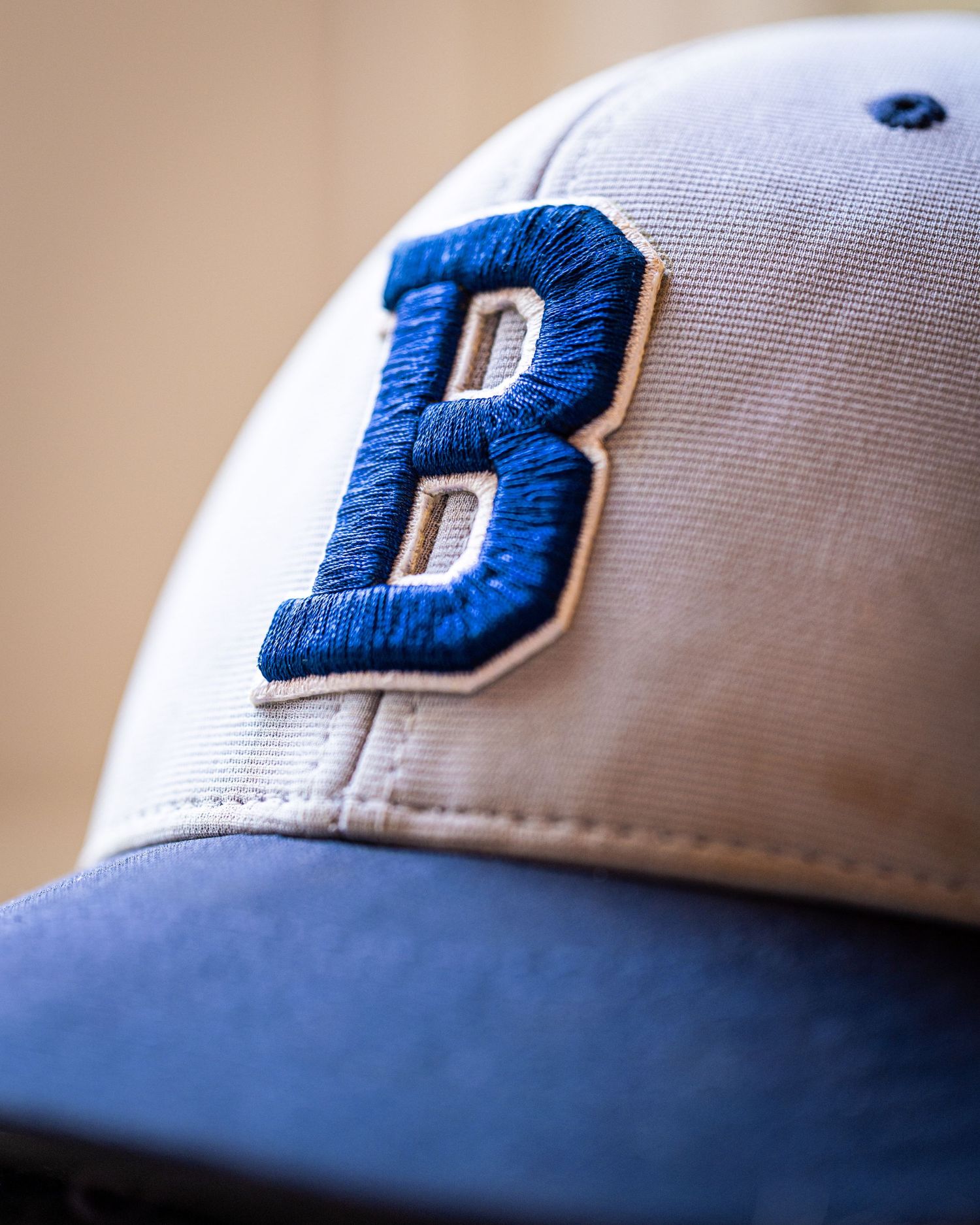 Elite macro photography of a baseball cap using flagship Canon camera and lenses.