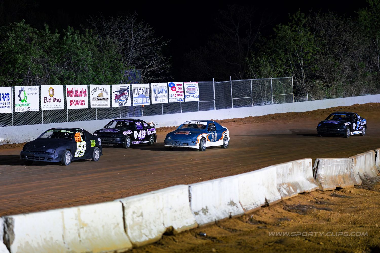 QRF Racing dirt track car at Potomac Speedway. High-speed motorsports action photography R&D by Fairfax-based Sporty-Clips Media.