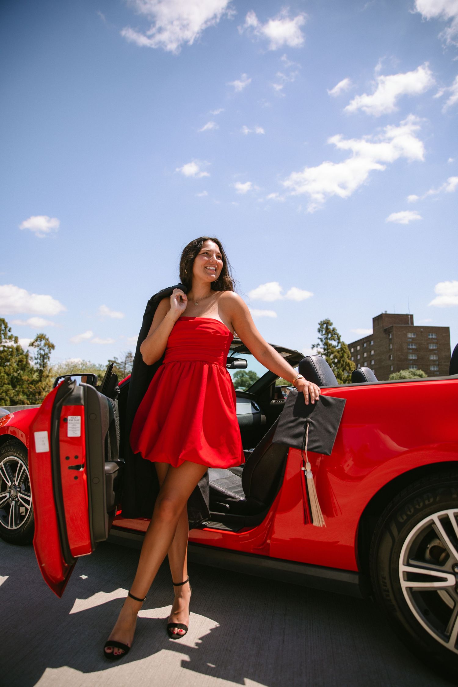A sequence of photos showing a person in a red dress entering a red sports car on a sunny day.