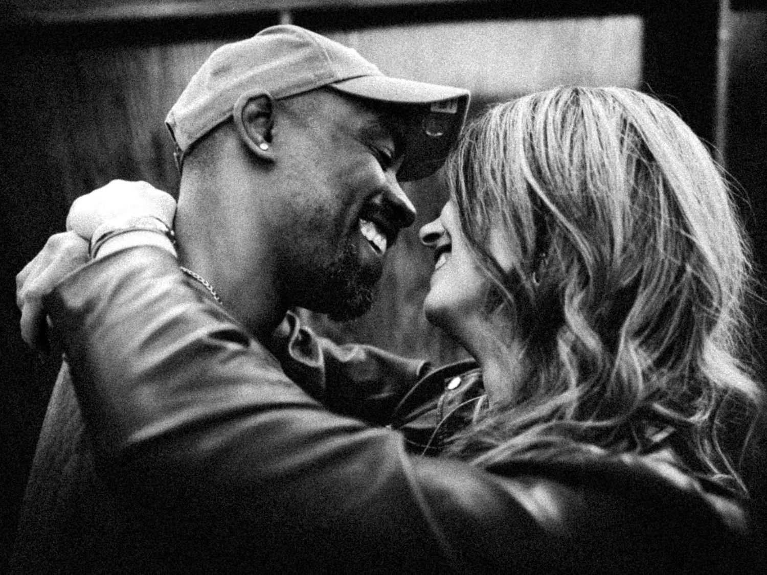 Black and white series shows couple in baseball cap sharing affectionate moments.