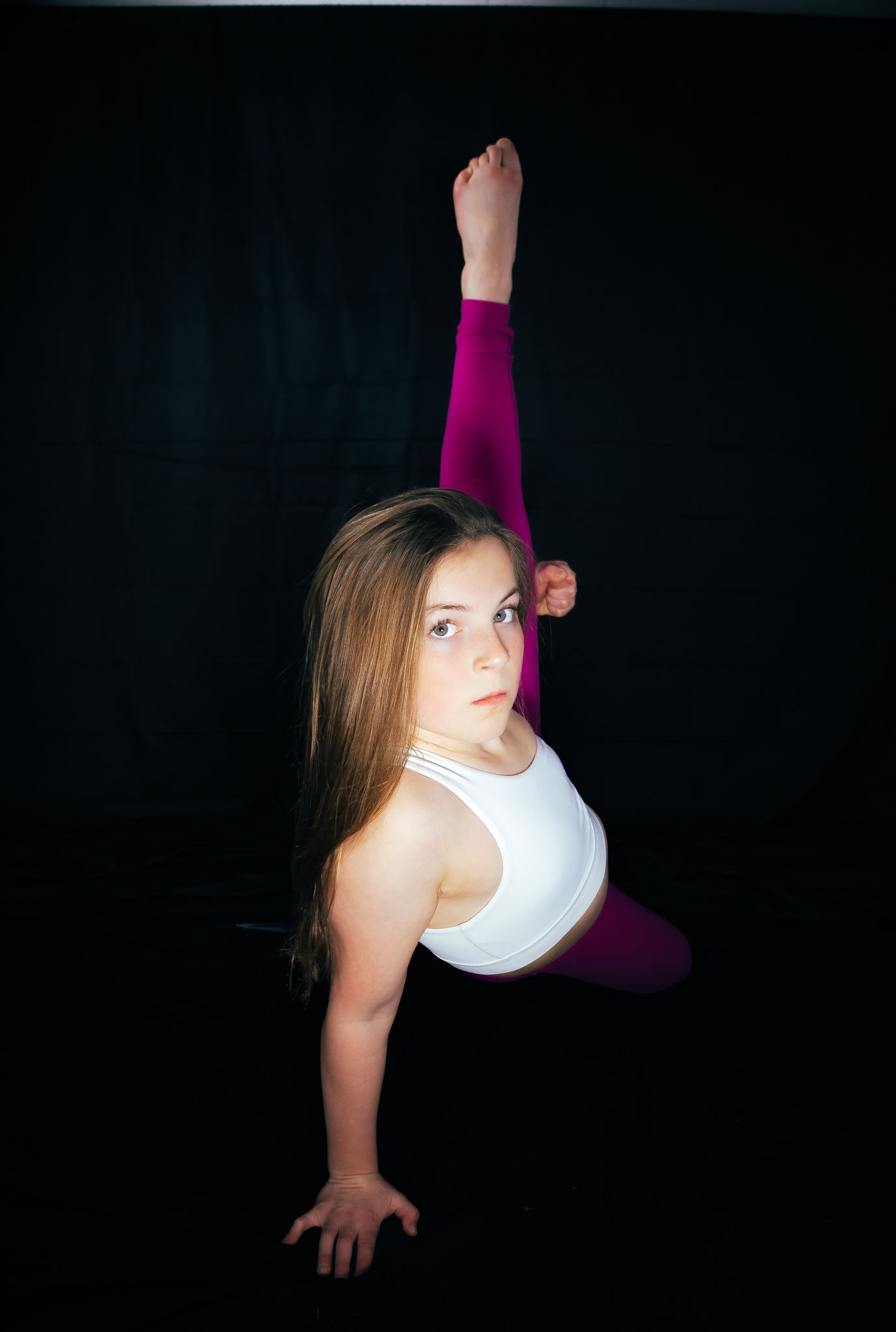 Artistic dance poses in white against a dark background show graceful movement and form.