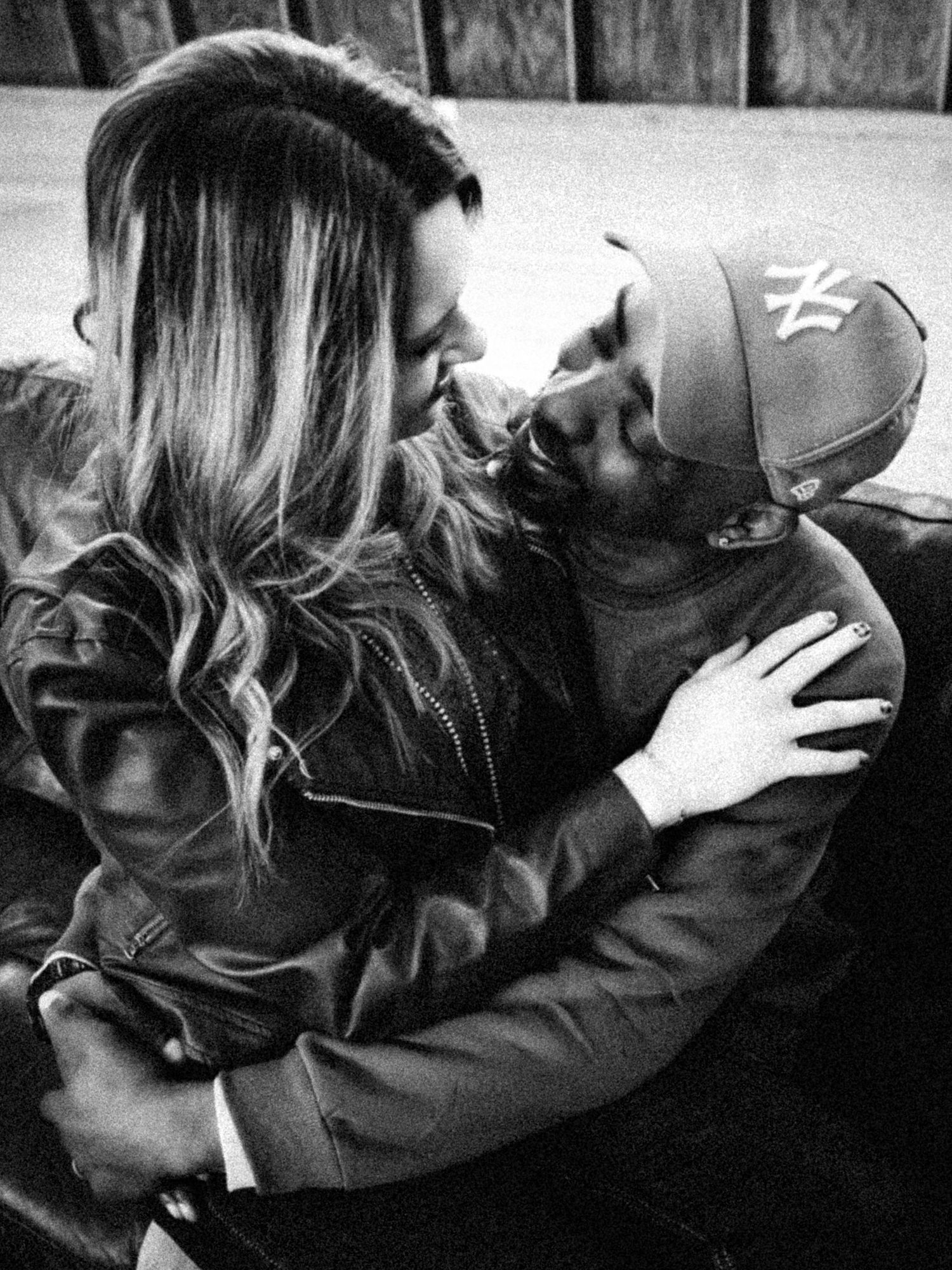 Romantic black and white photo sequence shows couple embracing and sharing intimate moments.