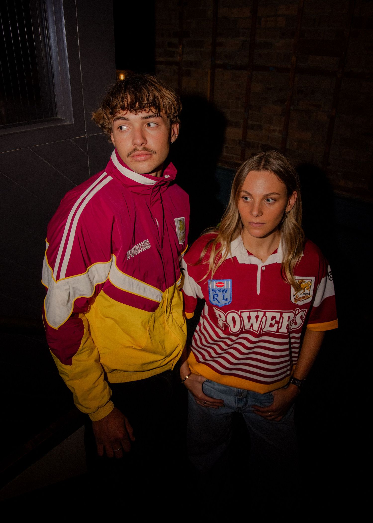 Two models wearing vintage Wests Tigers NRL rugby league jerseys and tracksuit jacket in maroon and gold. Sutherland photographer