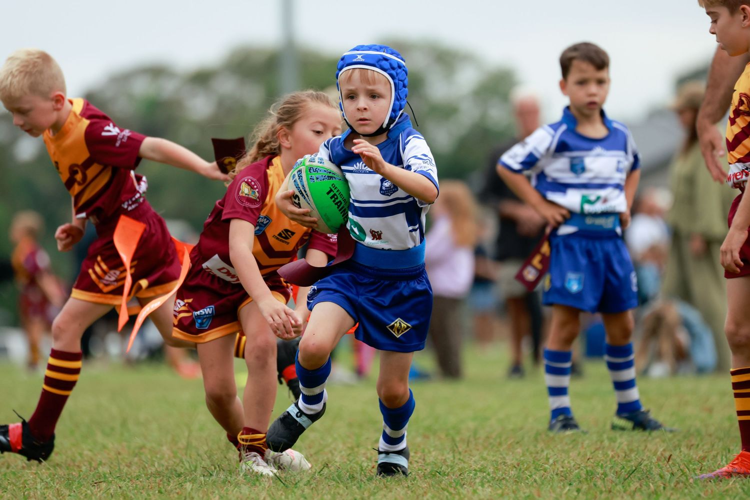 Sutherland Shire photographer Young rugby players compete for the ball during youth match.