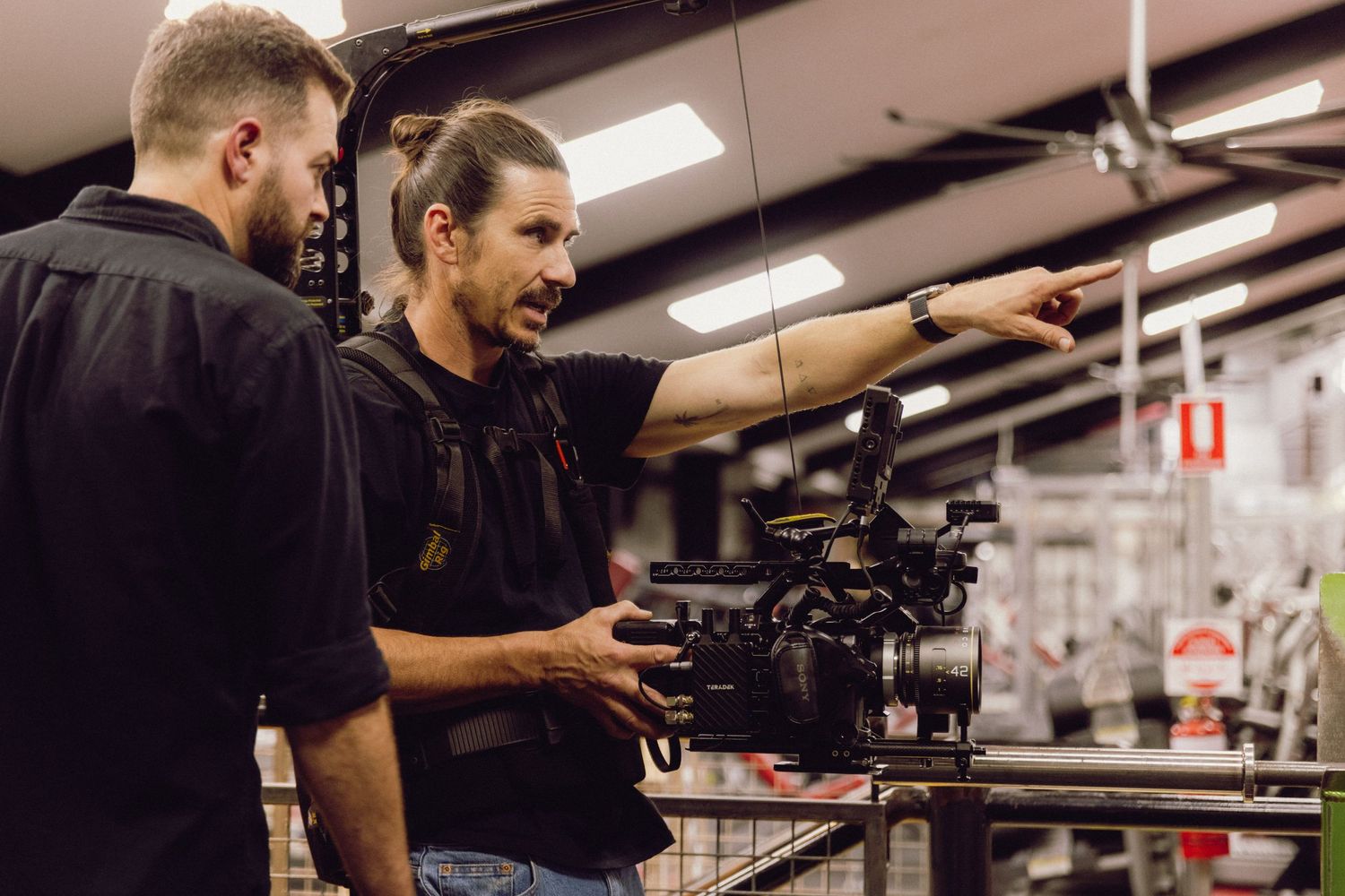 Wollongong videographer and photographer Restaurant staff working together in a modern industrial kitchen setting.
