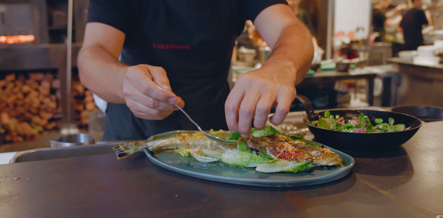 Wollongong based videographer captures Lennox Hastie Chef and owner of Firedoor cooking flathead over fire
