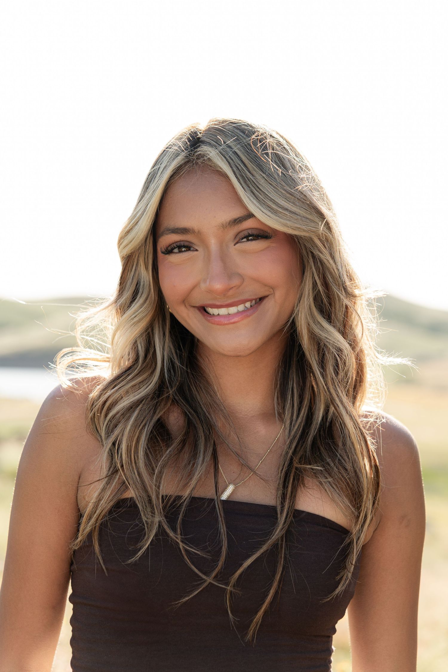 Close-up portrait series with natural lighting and warm sunset glow.