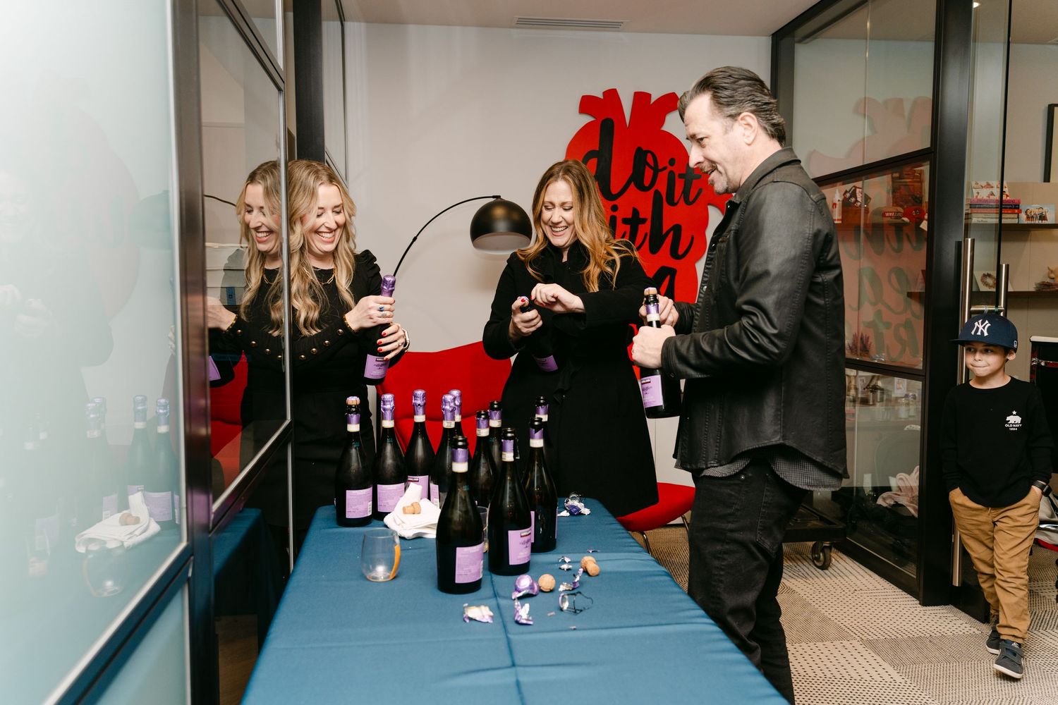 Modern office space decorated with red accents for a special event.