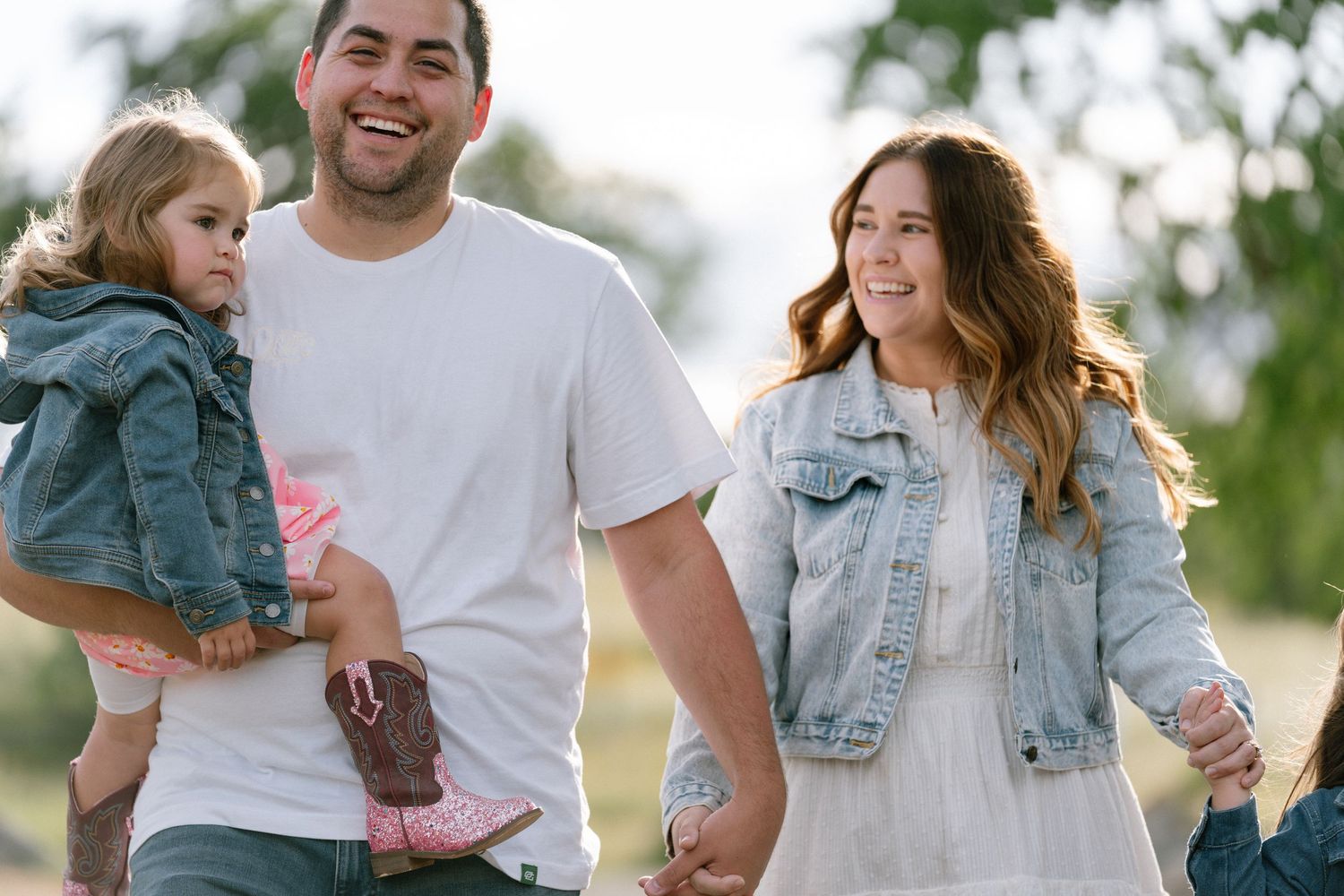 Joyful family interactions during a casual outdoor photo session.