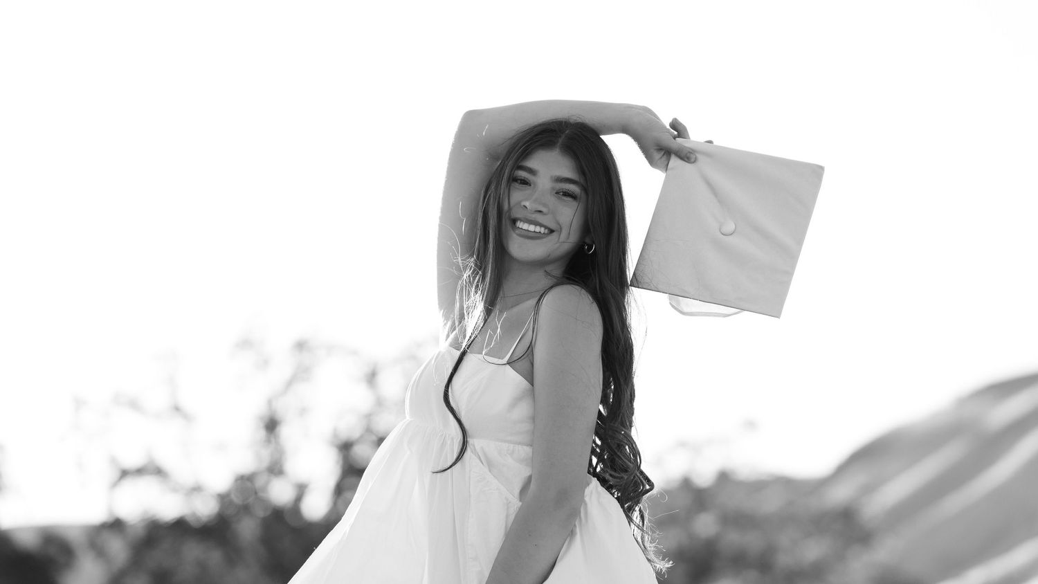 Black and white artistic portrait series with flowing fabric and natural lighting.