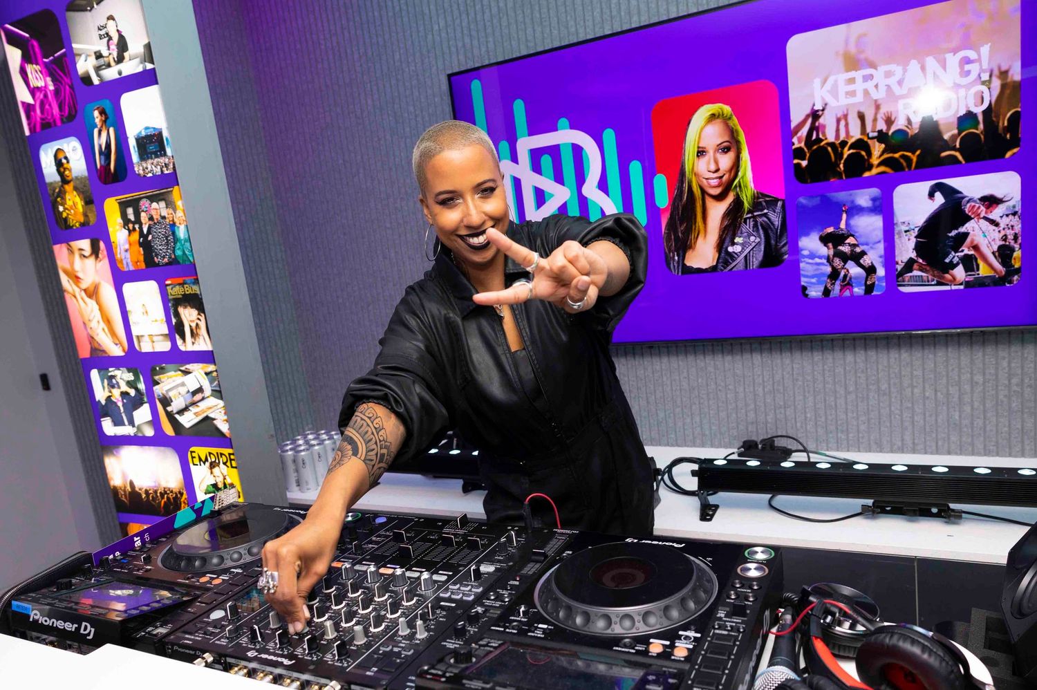 DJ equipment setup with purple lighting and electronic music controls in a professional studio setting. London Event Photographer
