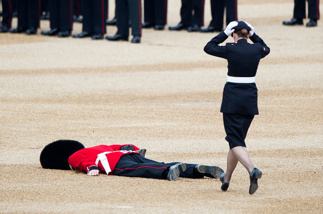 Military personnel in formal uniforms performing ceremonial drills outdoors. London Event Photographer