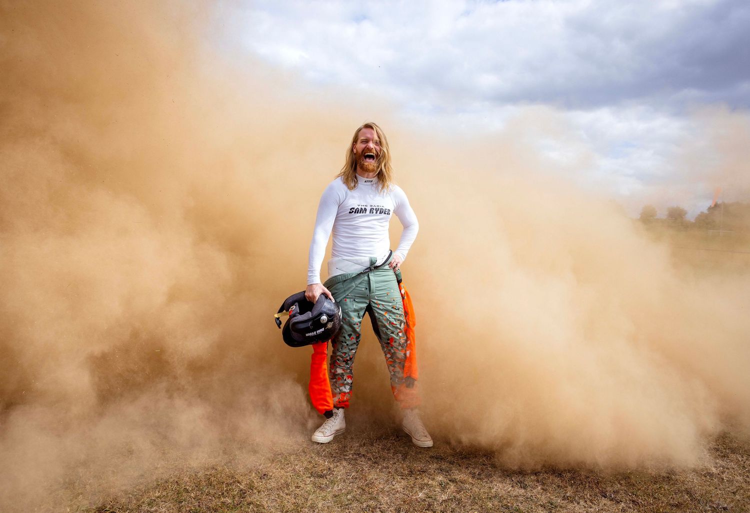 Action sequence showing dust clouds with figures emerging through desert terrain. London Event Photographer