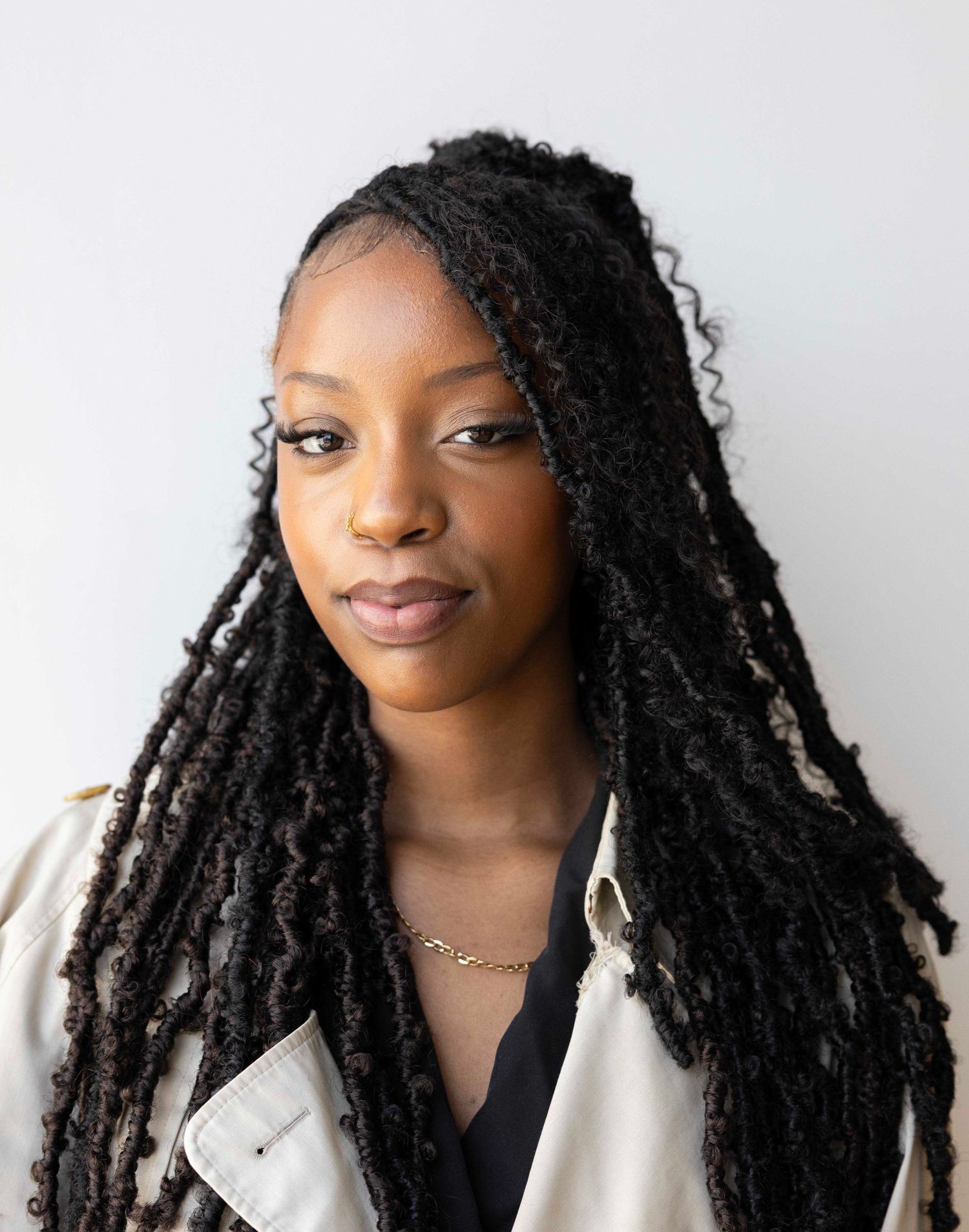 Professional headshot series in light colored blazer against white background. London Event Photographer