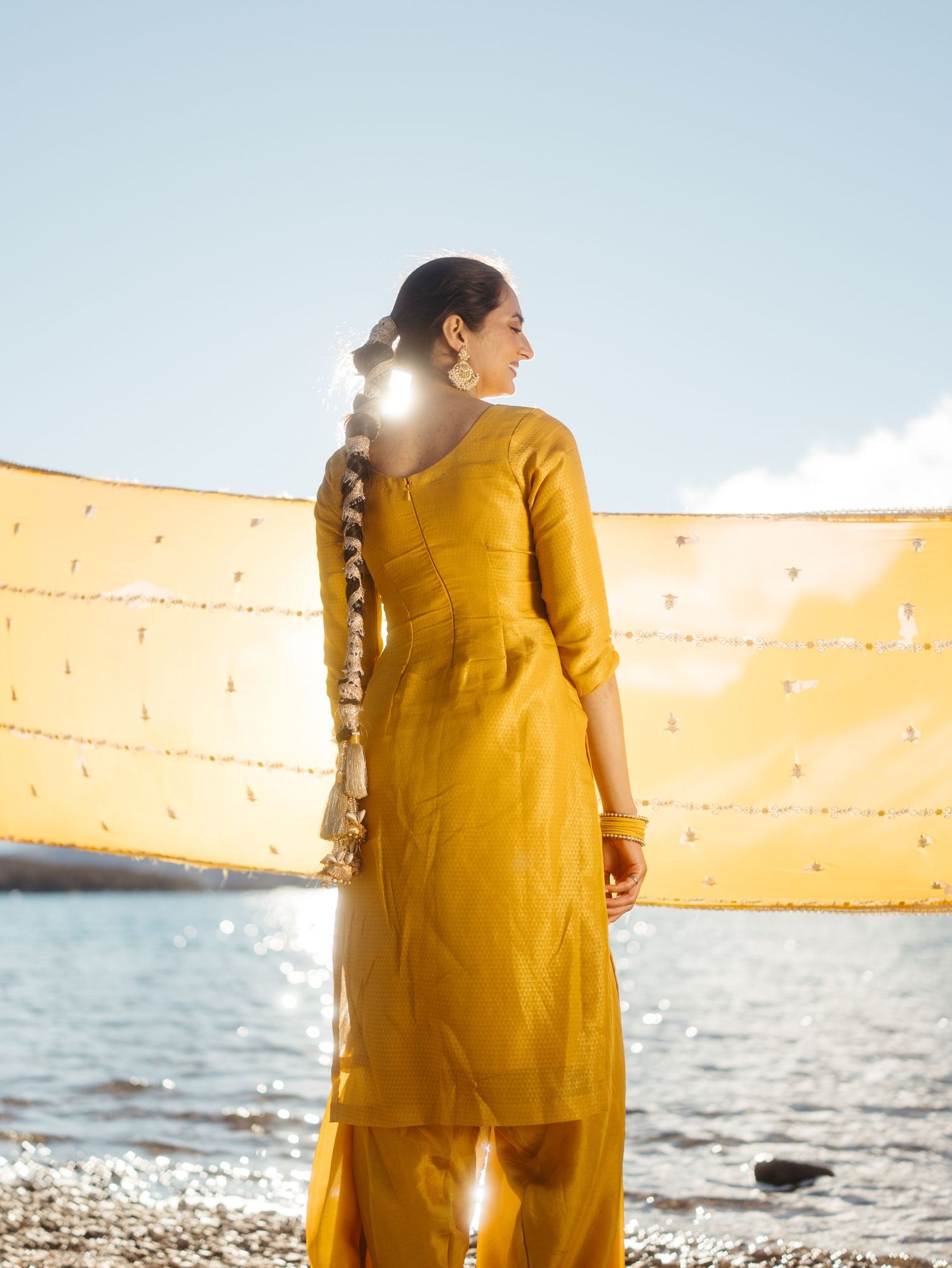 Bride solo pre wedding portrait in Banff mountains wearing traditional South Asian outfit