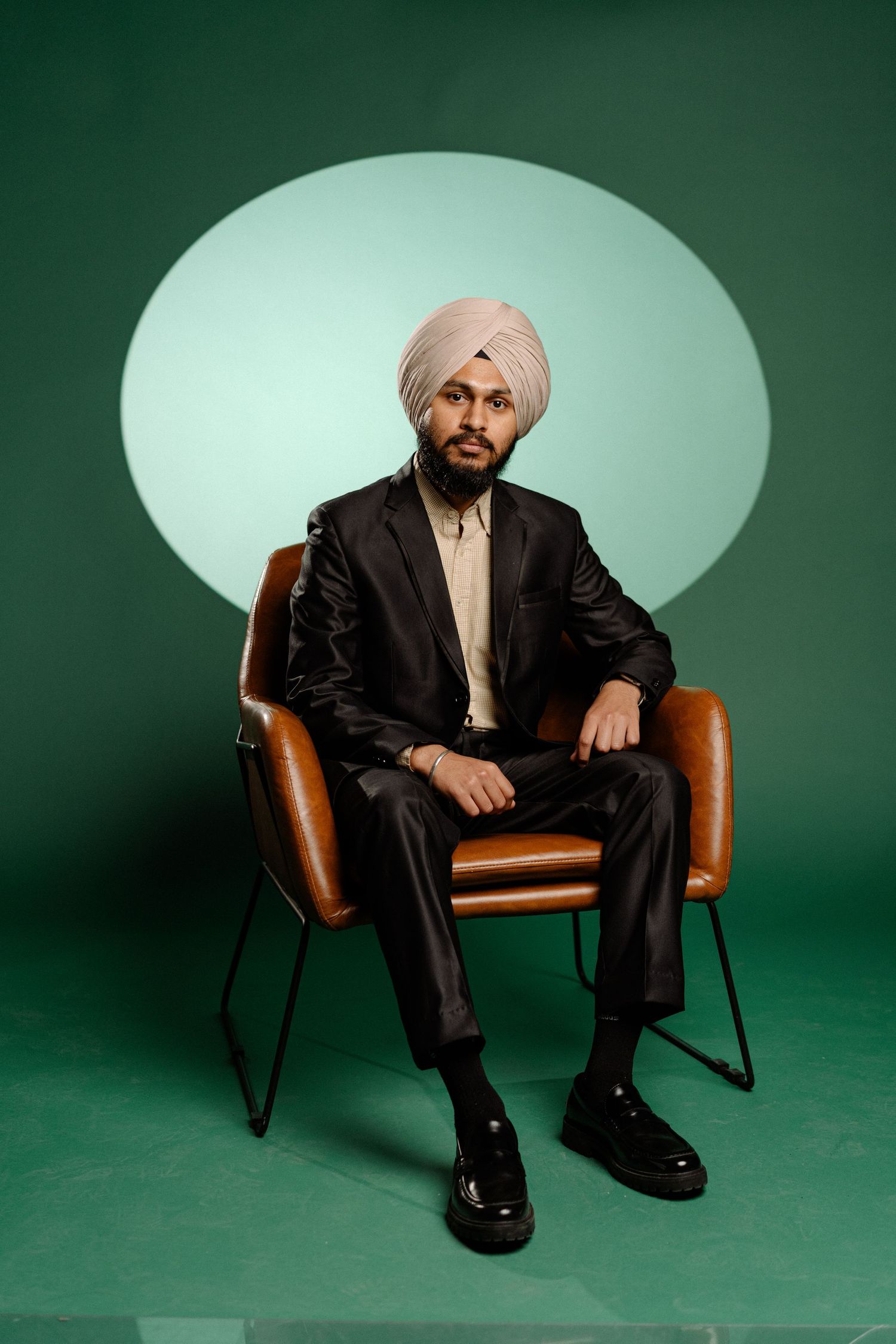Studio portrait of wedding photographer in creative studio workspace