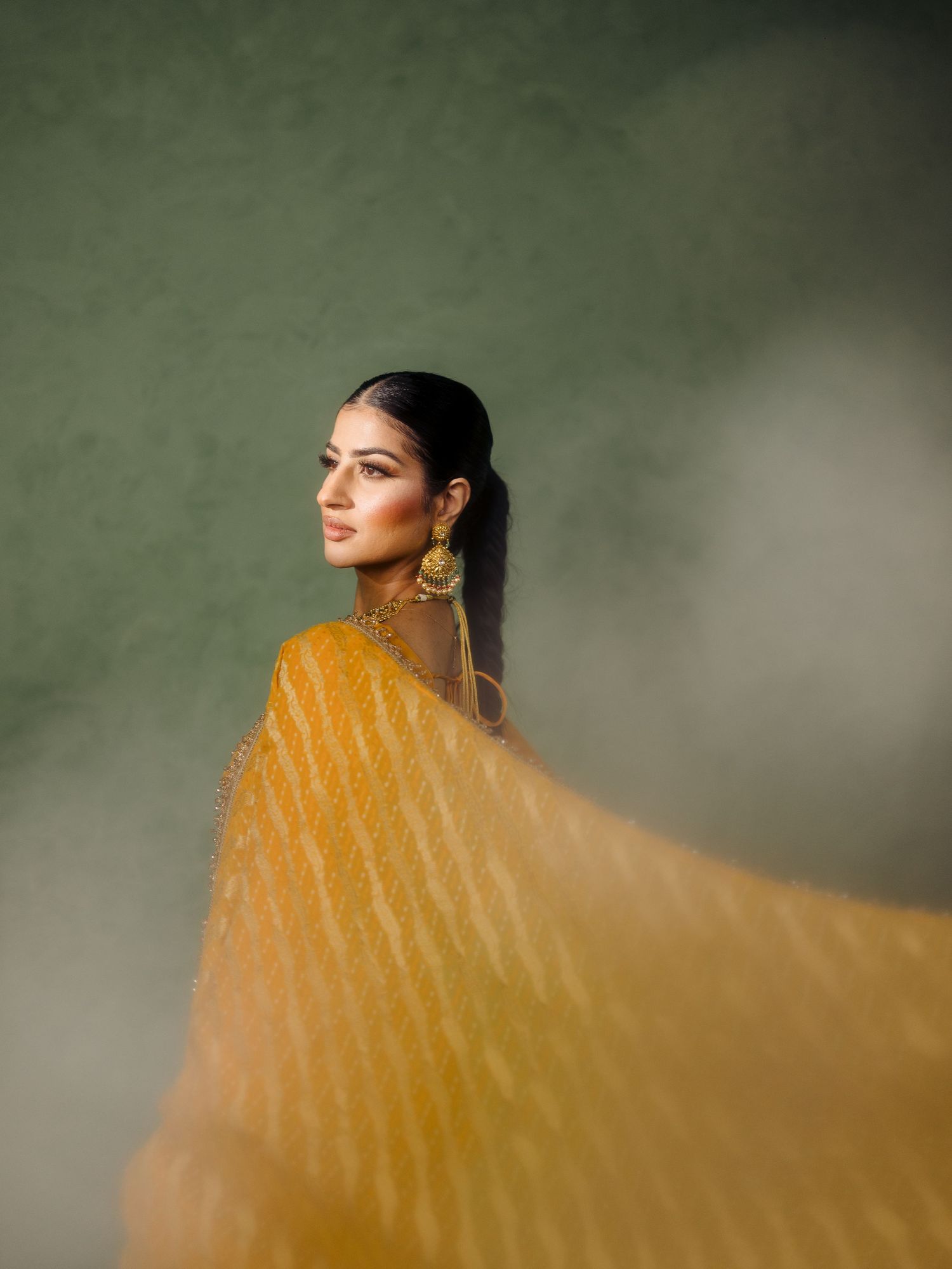 Bridesmaid portrait in traditional attire during wedding celebration