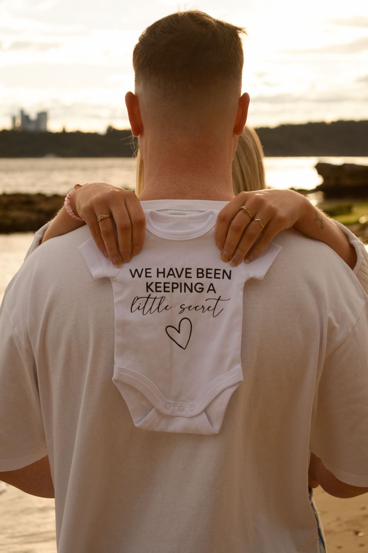 A series of white t-shirts with text messages being revealed in a progressive sequence at sunset.