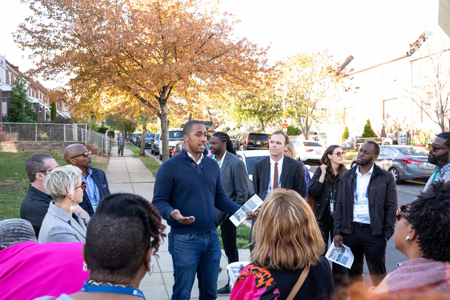 Crowd of people mingling at an outdoor business event.