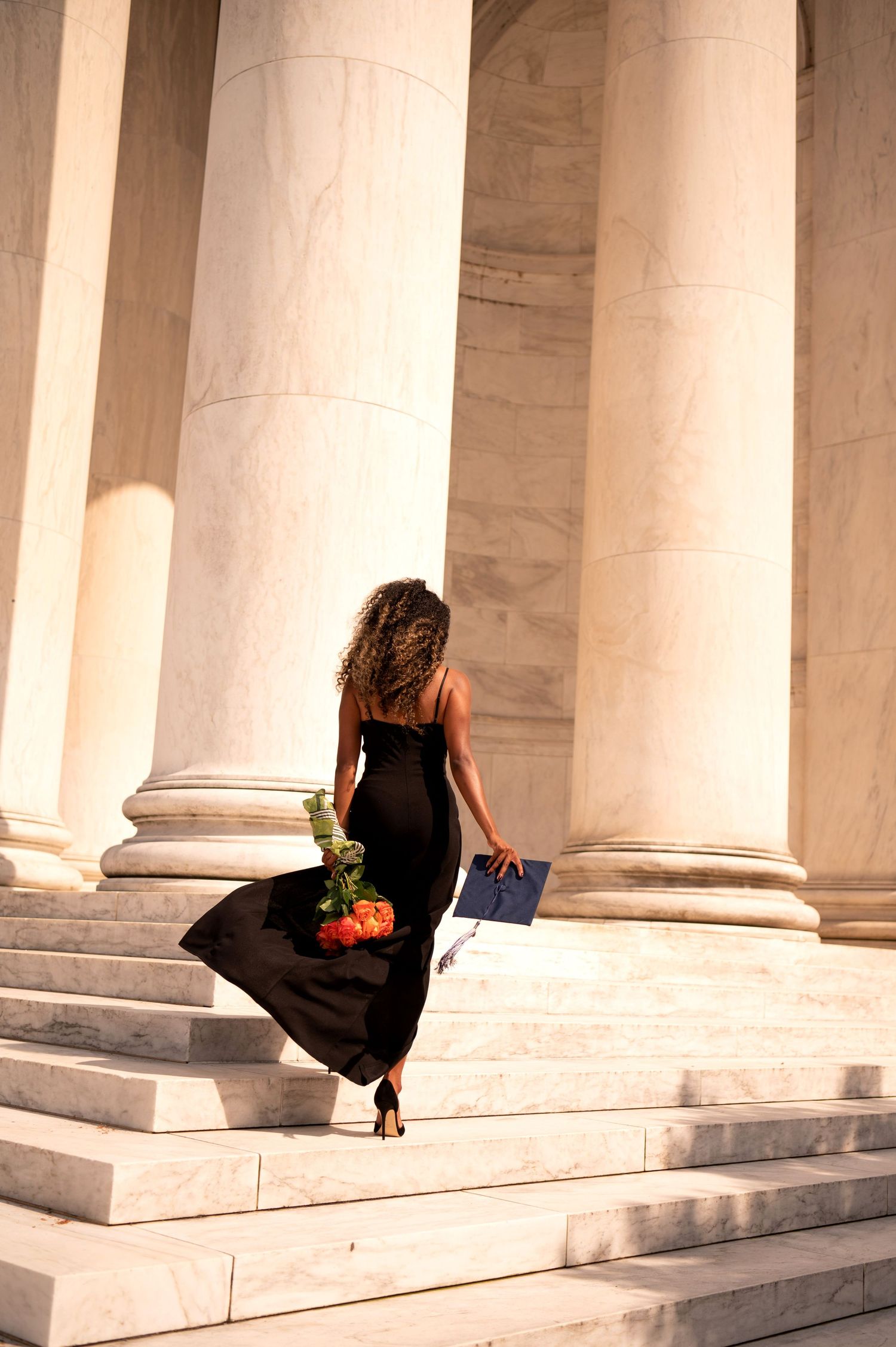 Series of white marble columns creating architectural perspective in classical building.