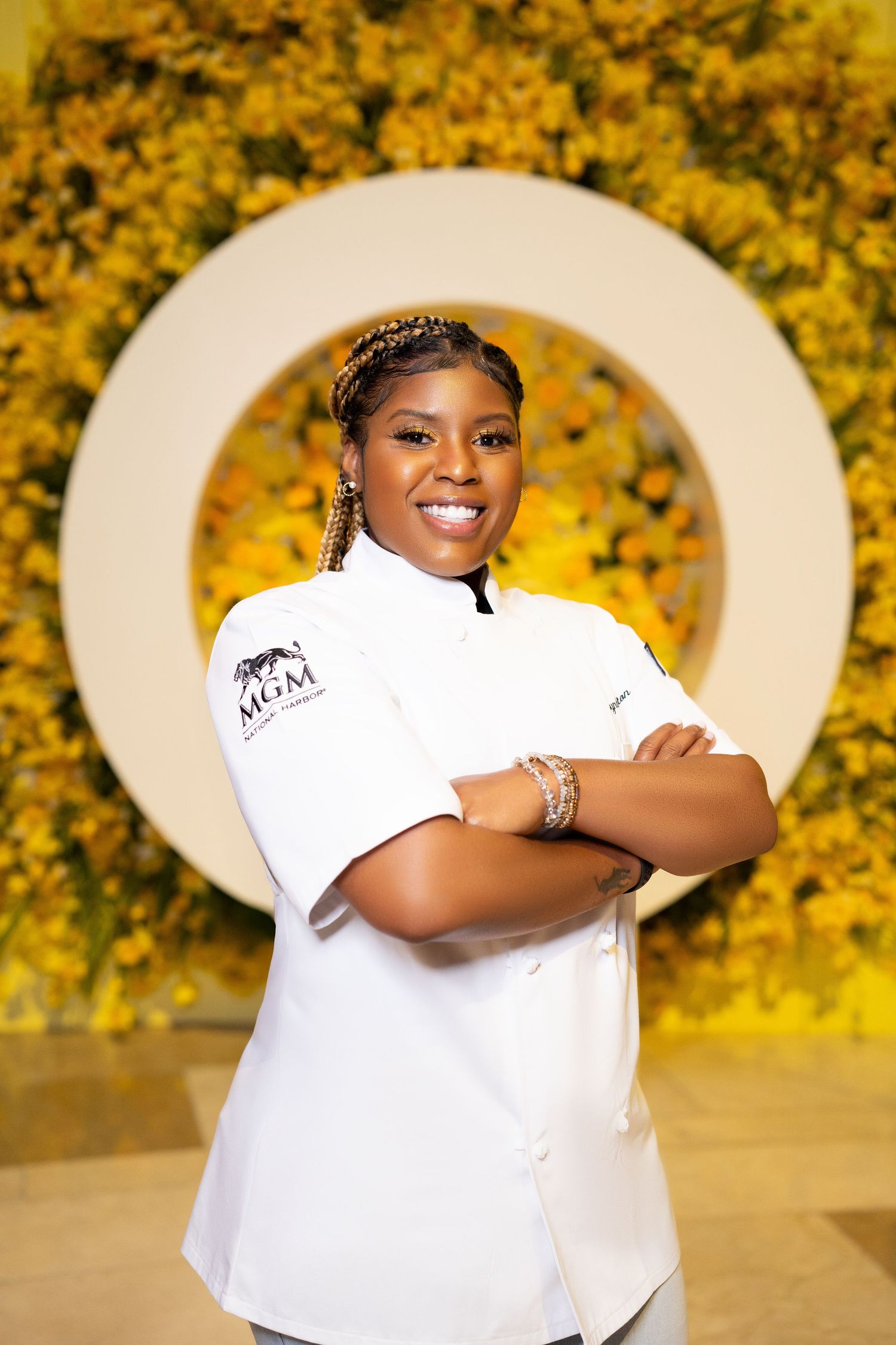 Professional headshots against yellow floral backdrop wearing white branded uniform.