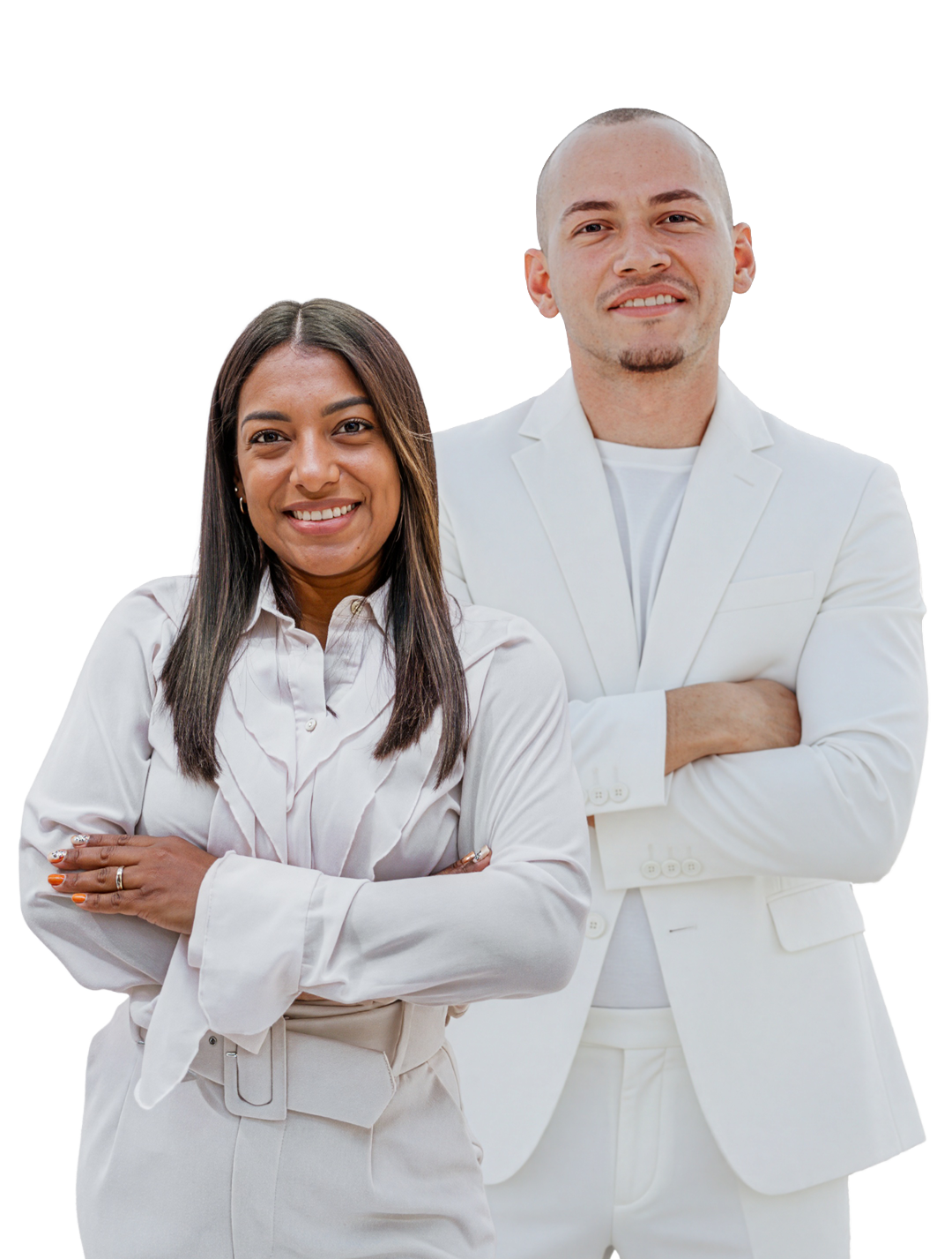 Smiling couple in matching white outfits posing with arms crossed against a clean white background.