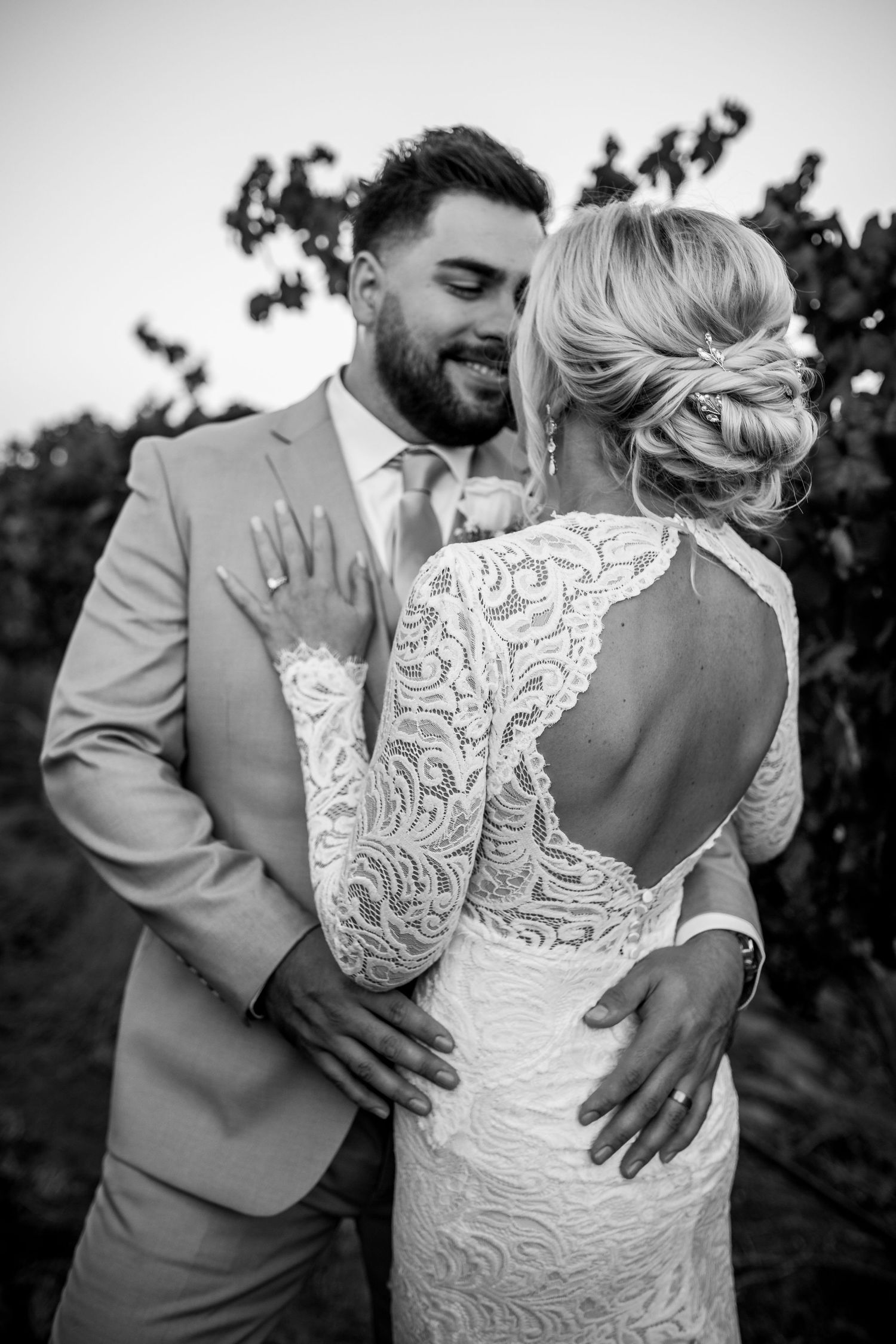 Groom looking at bride during first look at Arizona wedding