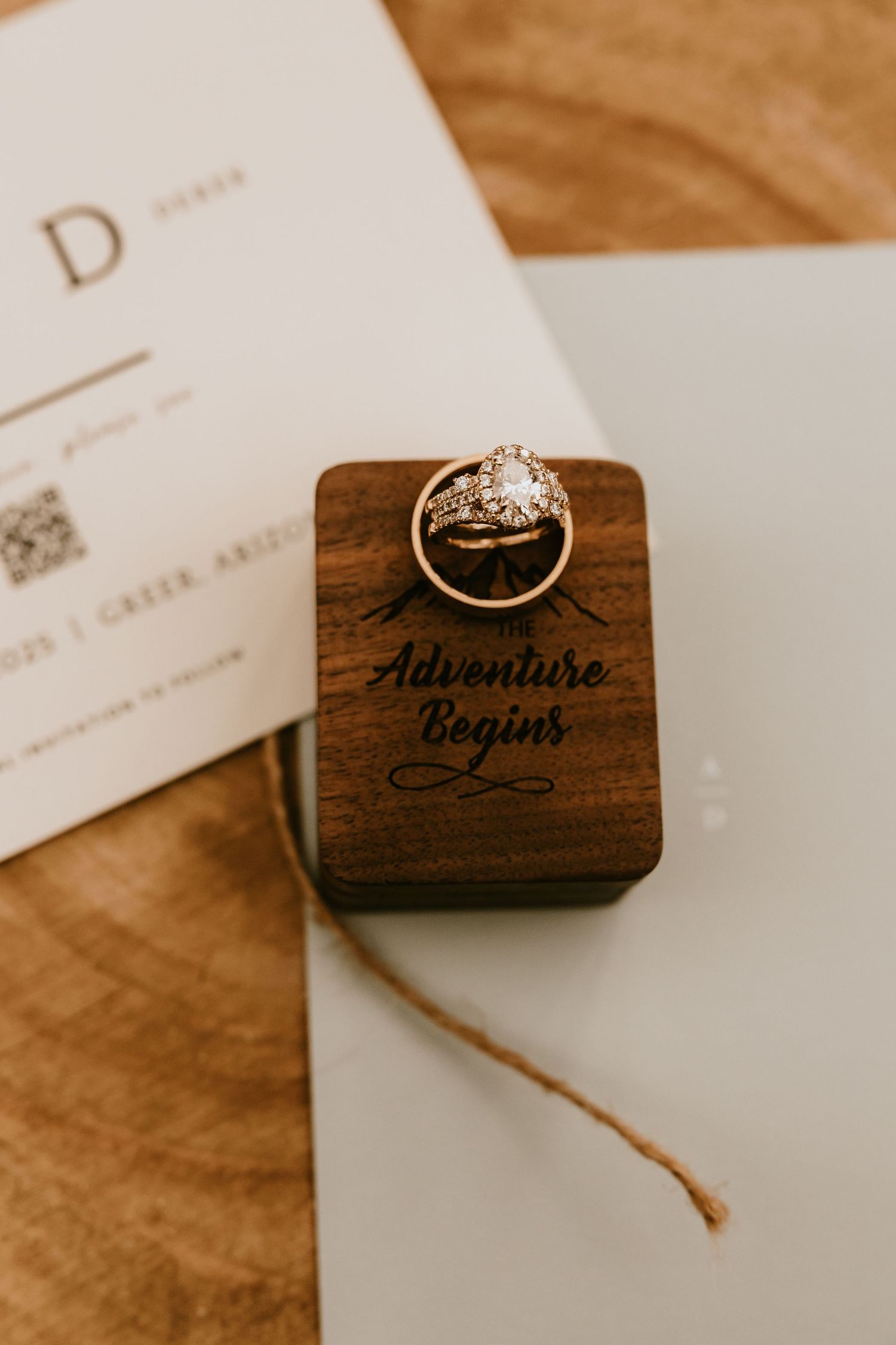 Arizona wedding invitations styled with rings and flowers