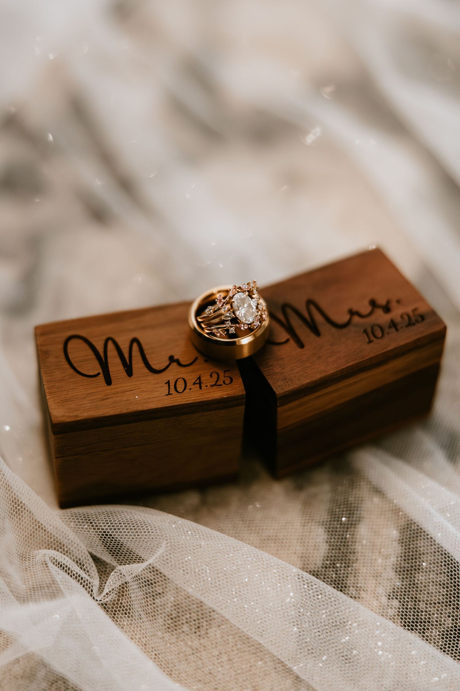 Close-up of wedding rings on desert rock in Phoenix golden-hour photography