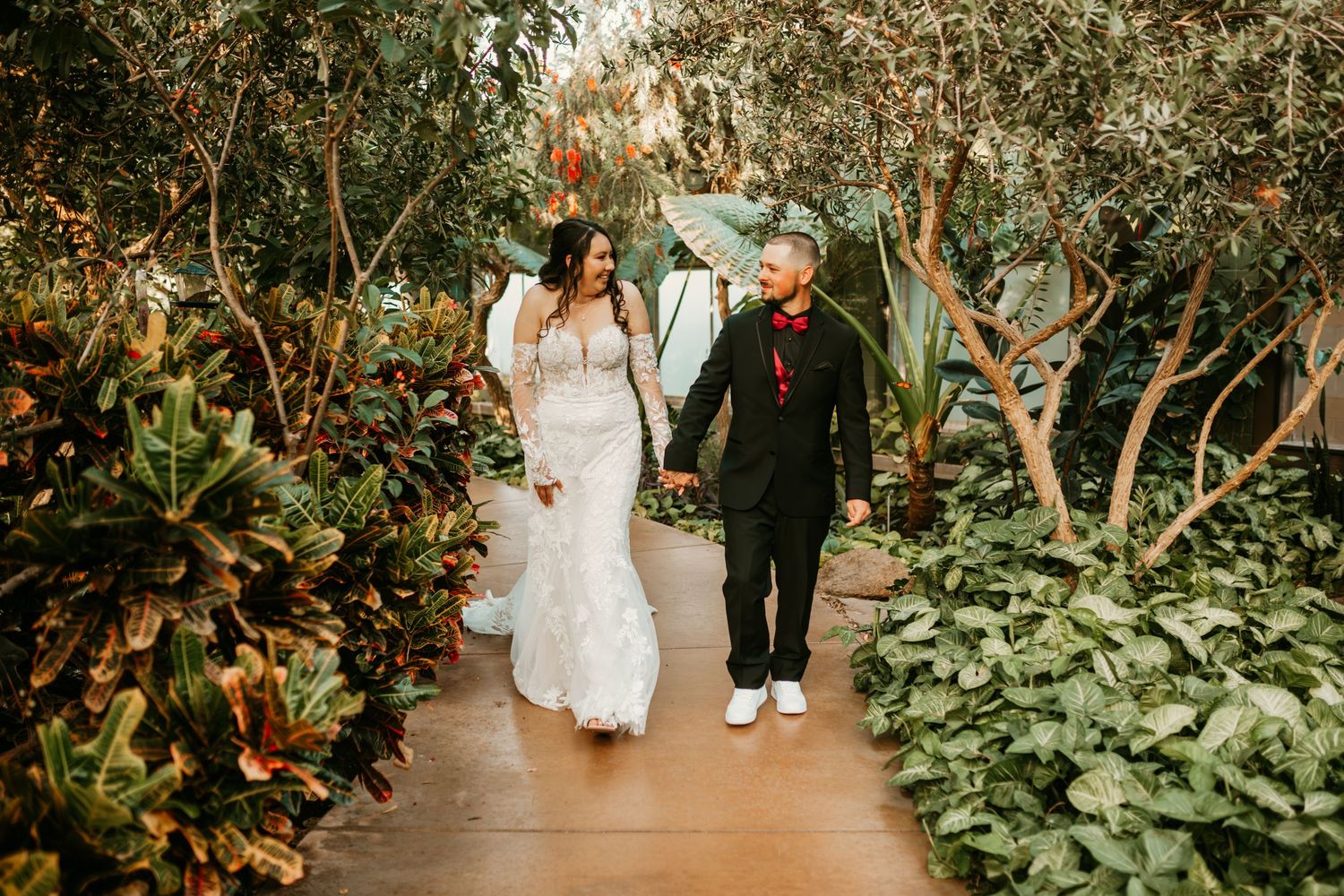 Alexis and Kyle holding hands under desert sky in Phoenix, Arizona