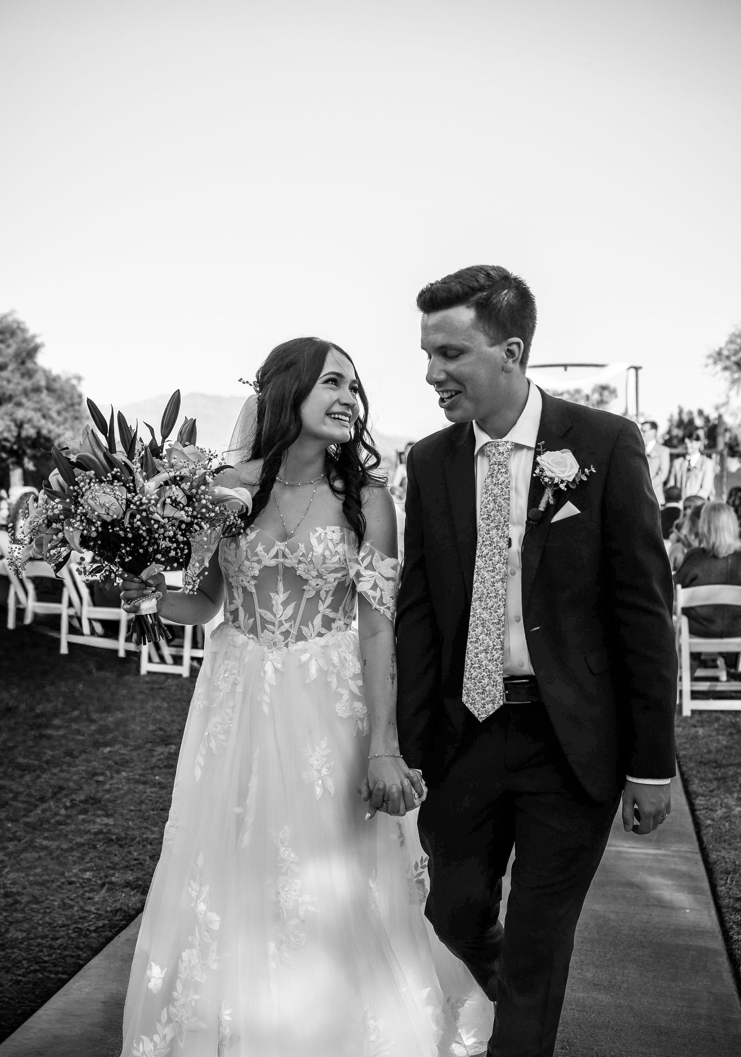 Bride and groom sharing a candid moment at sunset in Phoenix, Arizona wedding photography