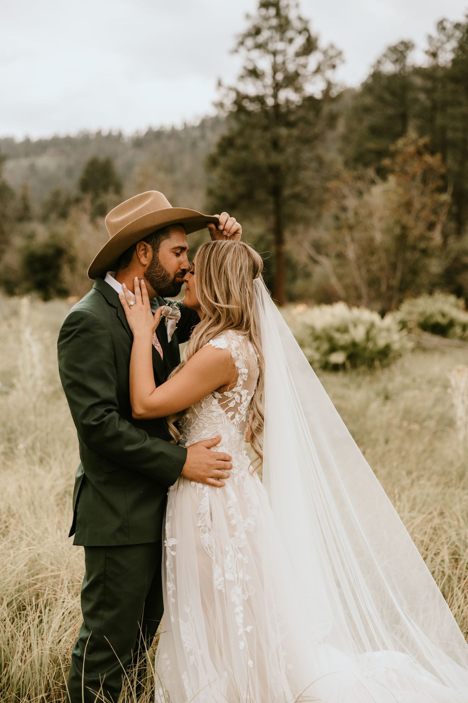 Sunset wedding portraits of couple embracing in Arizona desert
