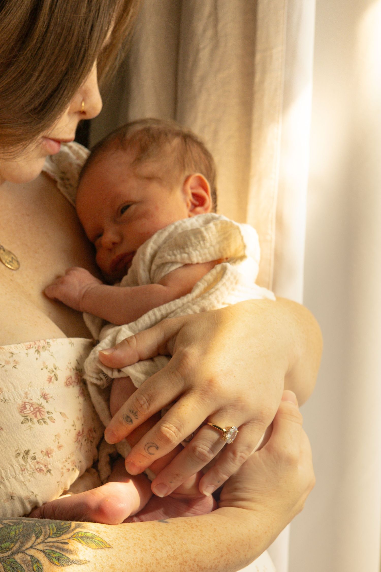 Tacoma WA lifestyle newborn photo — mom and baby by window in natural light, Puyallup, Gig Harbor, South Sound