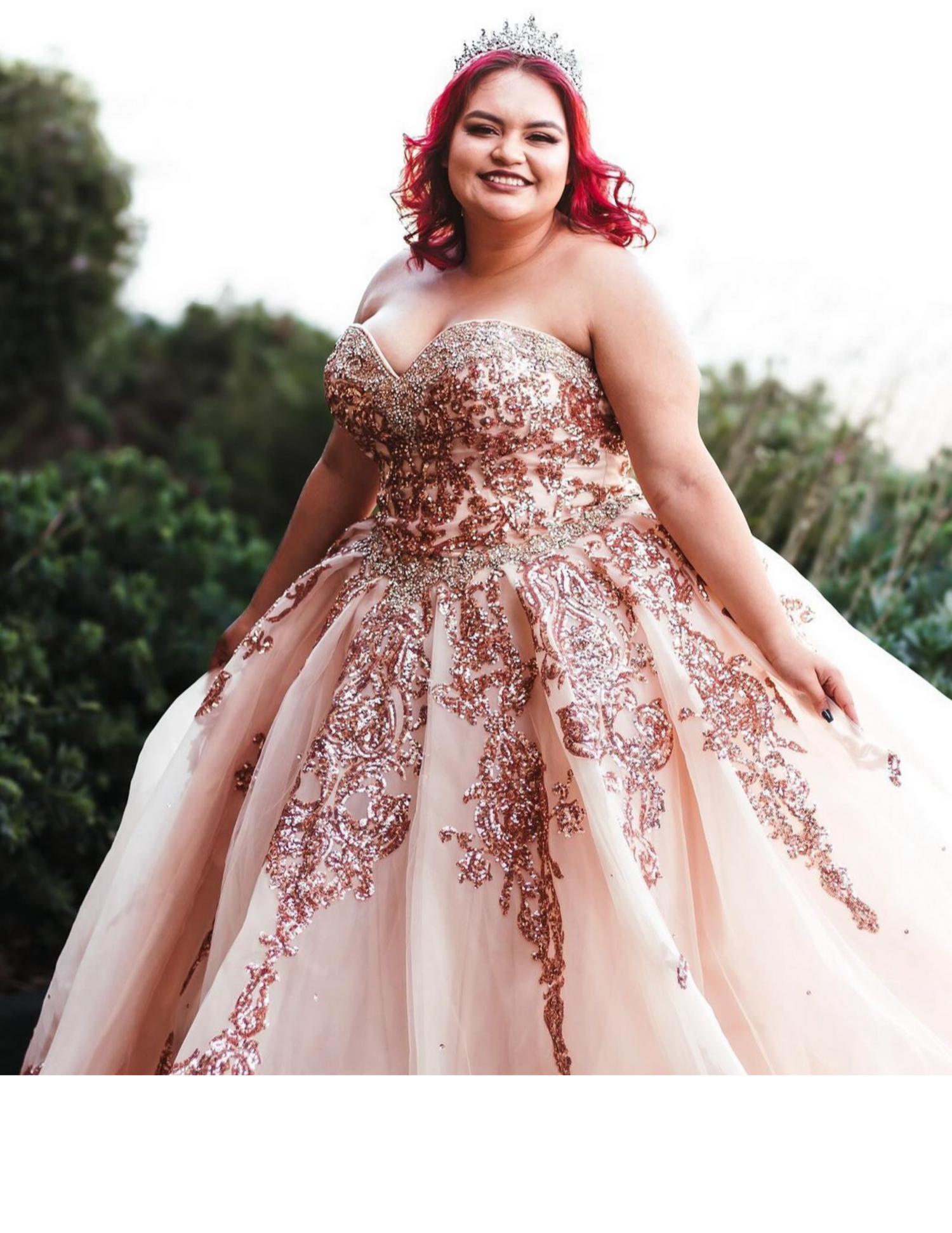 Stunning rose gold embellished ball gown with intricate floral details and strapless sweetheart neckline photographed outdoors.