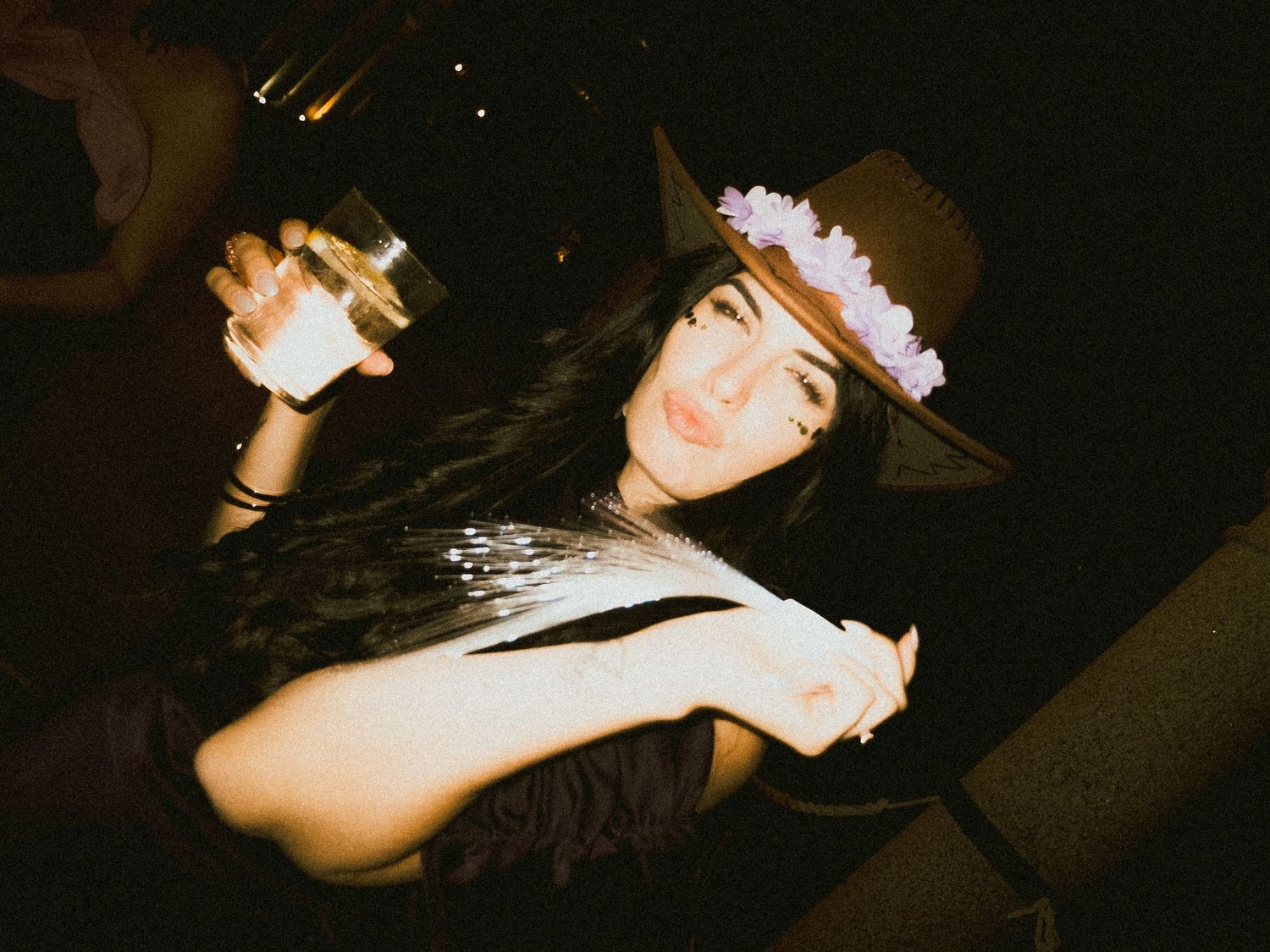 Dark atmospheric party photos showing people dancing and celebrating.