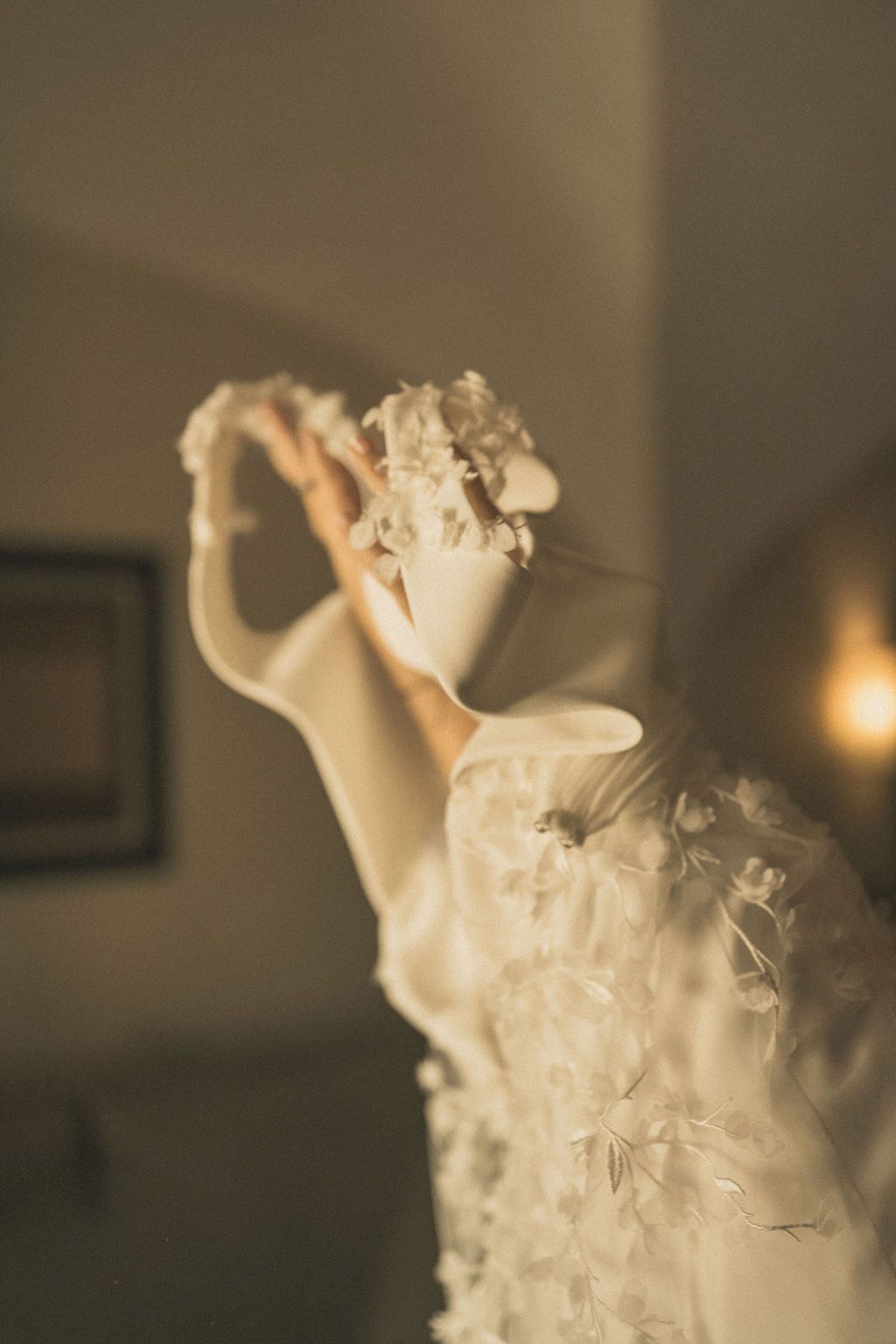 Ethereal movement of white fabric in soft, dreamy lighting.
