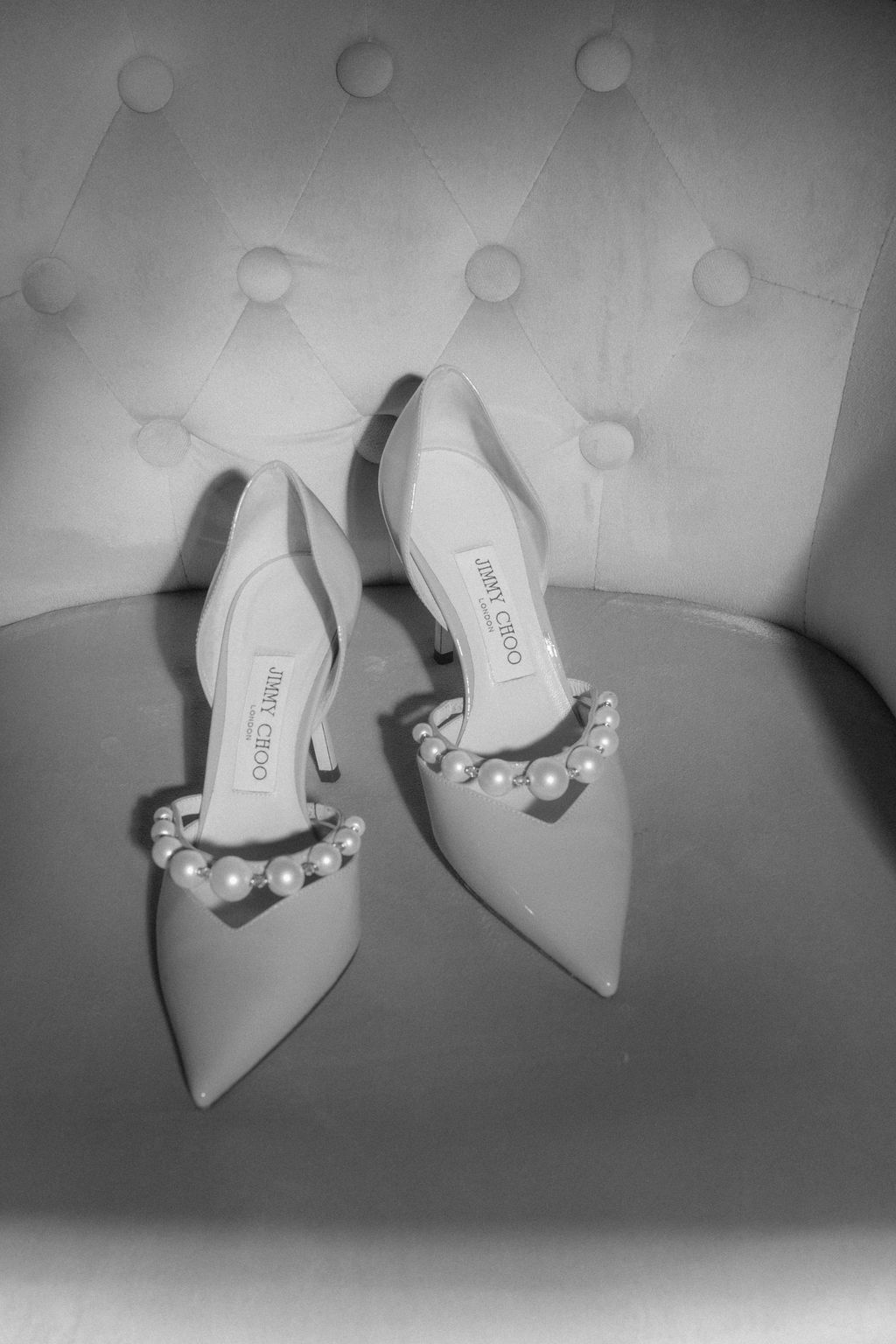 Elegant pearl-embellished pointed toe slingback heels in gray shown from multiple angles.