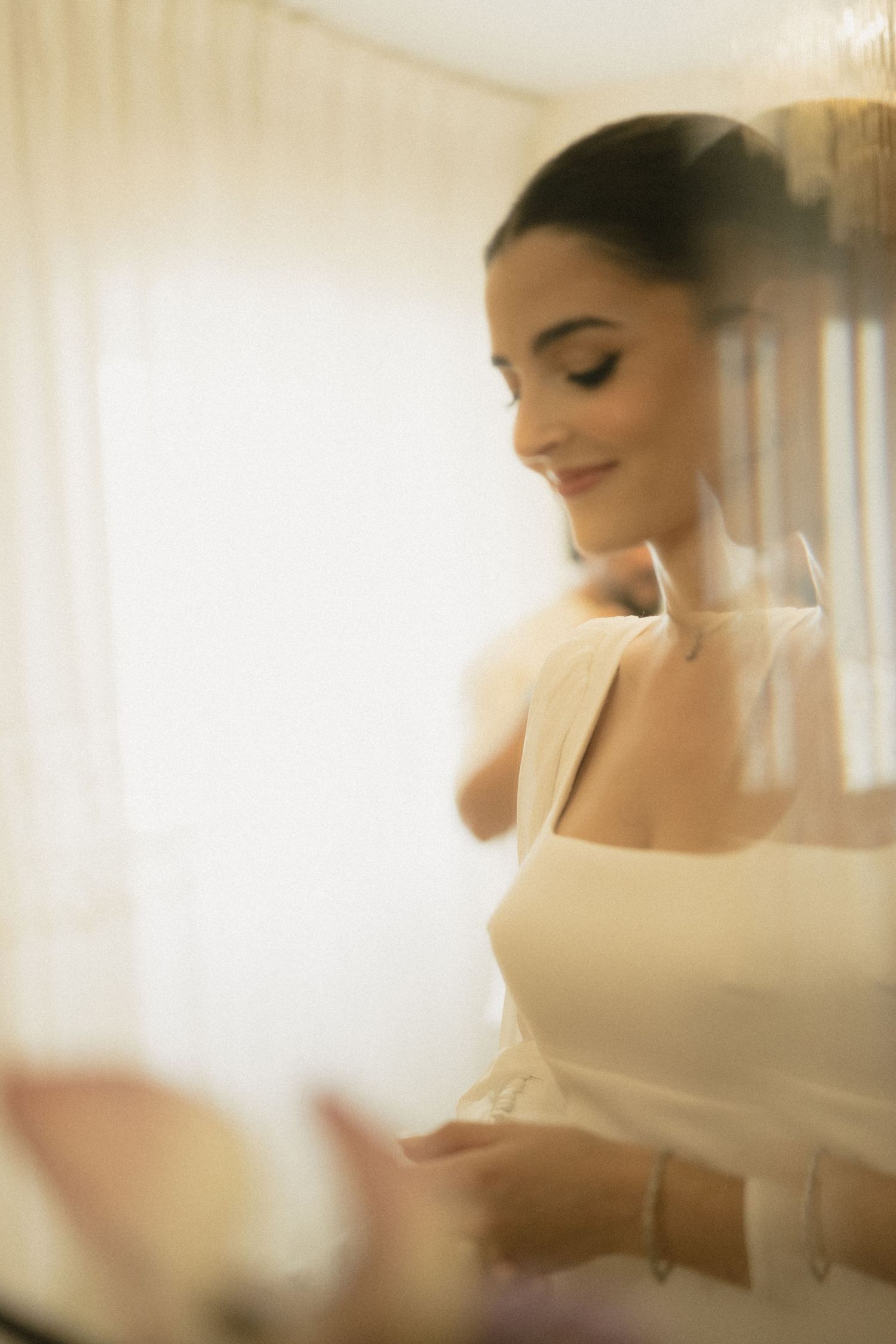Elegant white bridal preparations captured in soft, dreamy lighting.