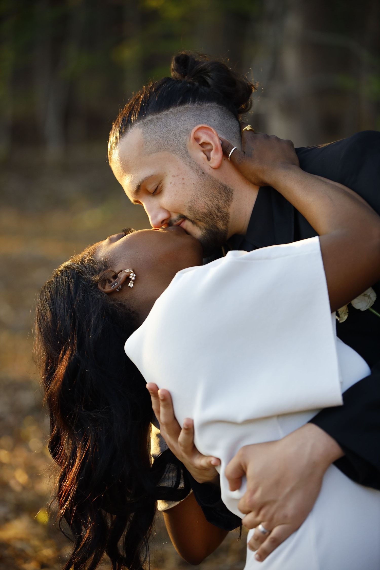 Romantic sunset portrait session in autumn woods.